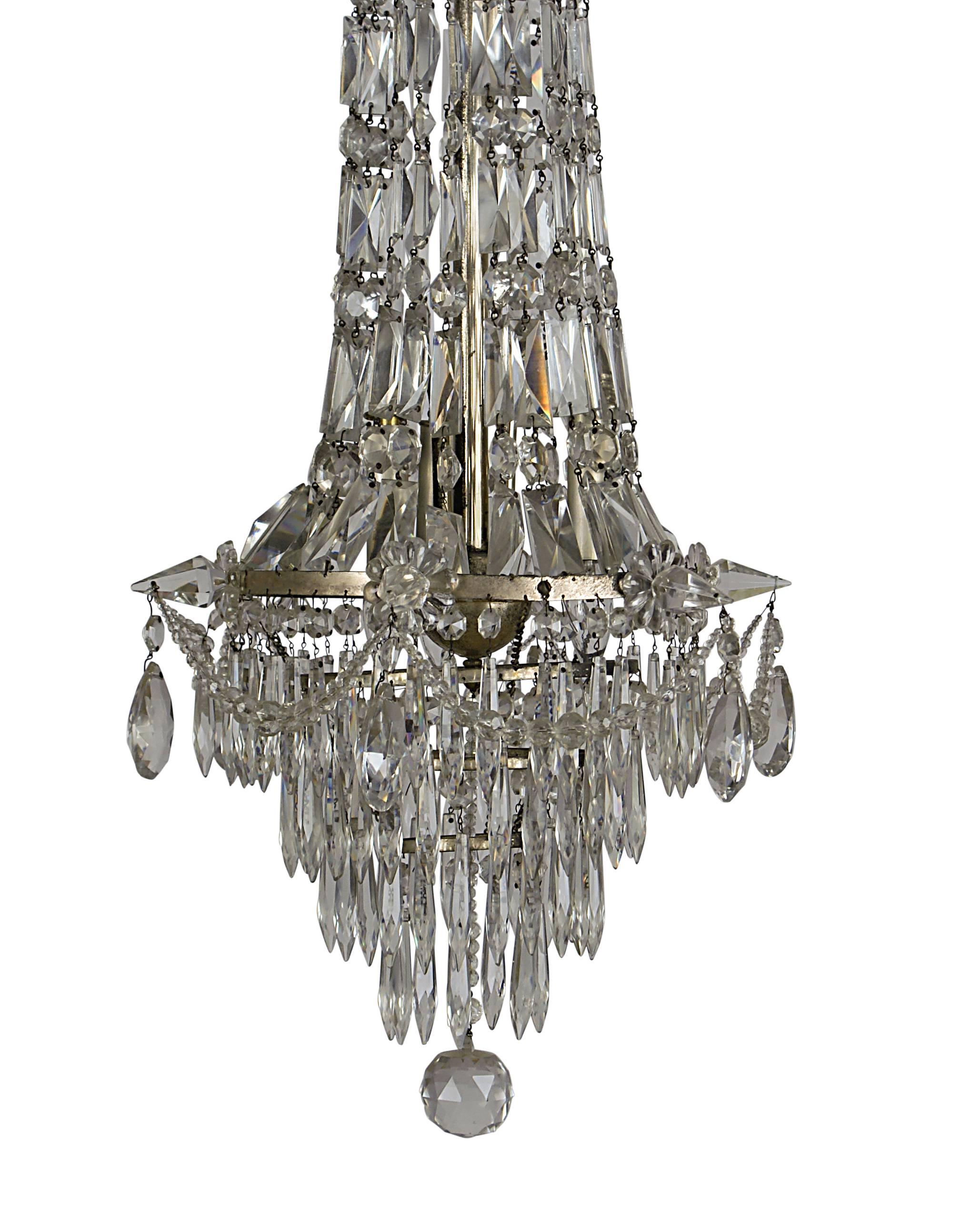 A handsome faceted and polished crystal pendant/chandelier made in France, circa 1900. Tall and narrow with light grey toned crystal. Wired recently for electricity.