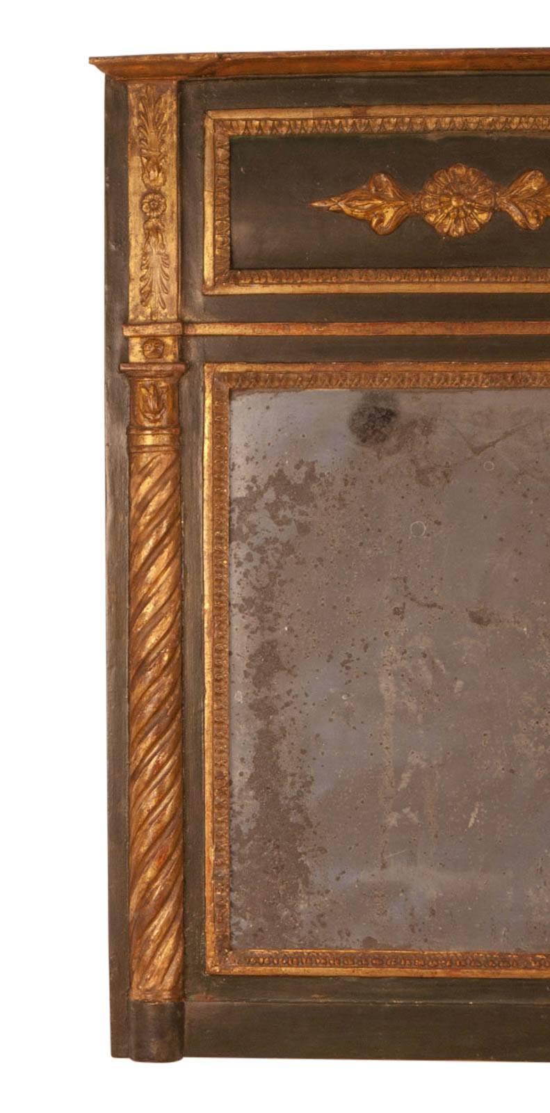 A French Empire painted and giltwood mirror, circa 1830. The paint is a dark bottle green.