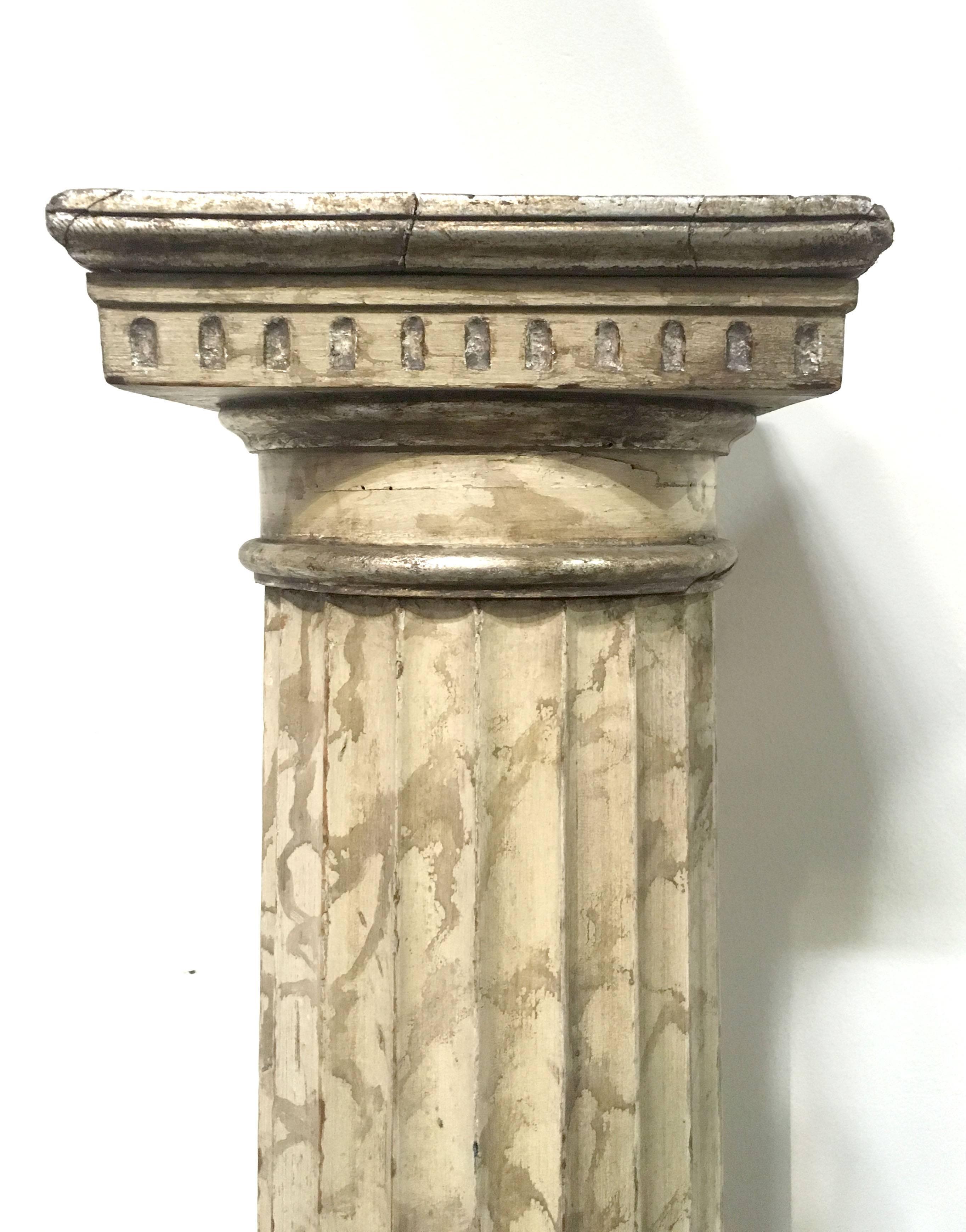 Late 18th century pair of Italian neoclassical parcel gilt and faux marble Doric columns. Each Hand-painted with Champagne leaf accents.