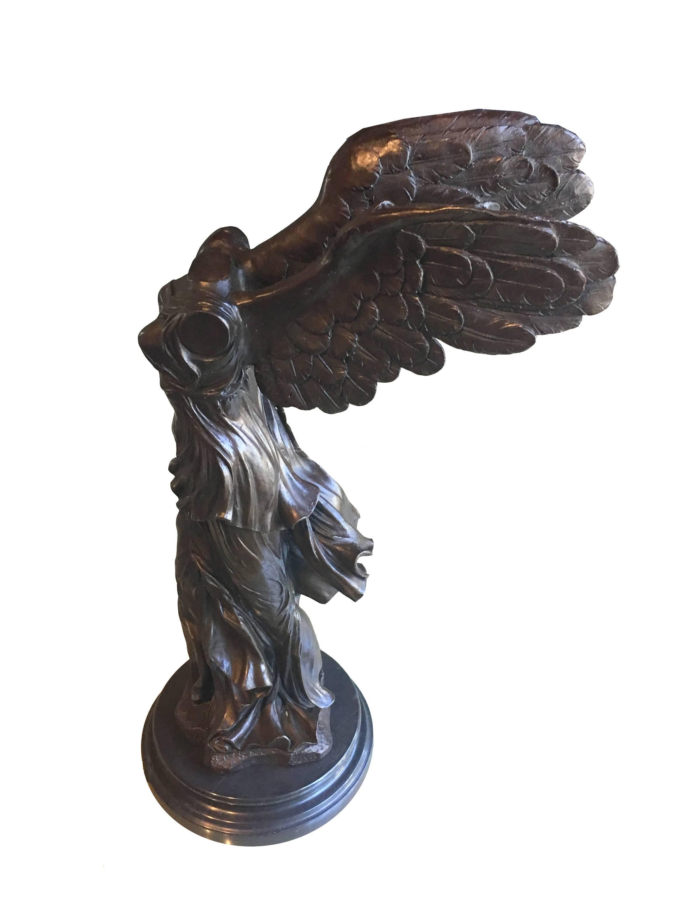 Contemporary heavy cast bronze reproduction of a 19th century winged sculpture of victory NIKE of Samothrace, with beautiful patina and placed on a polished marble base. Signed by Milo.

