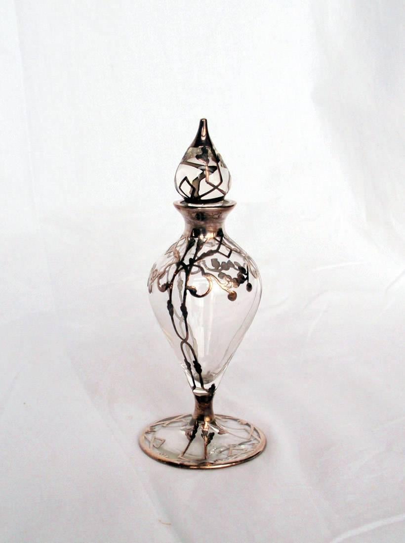 Sterling overlay perfume bottles in various sizes, circa 1900. Price is per individual item.