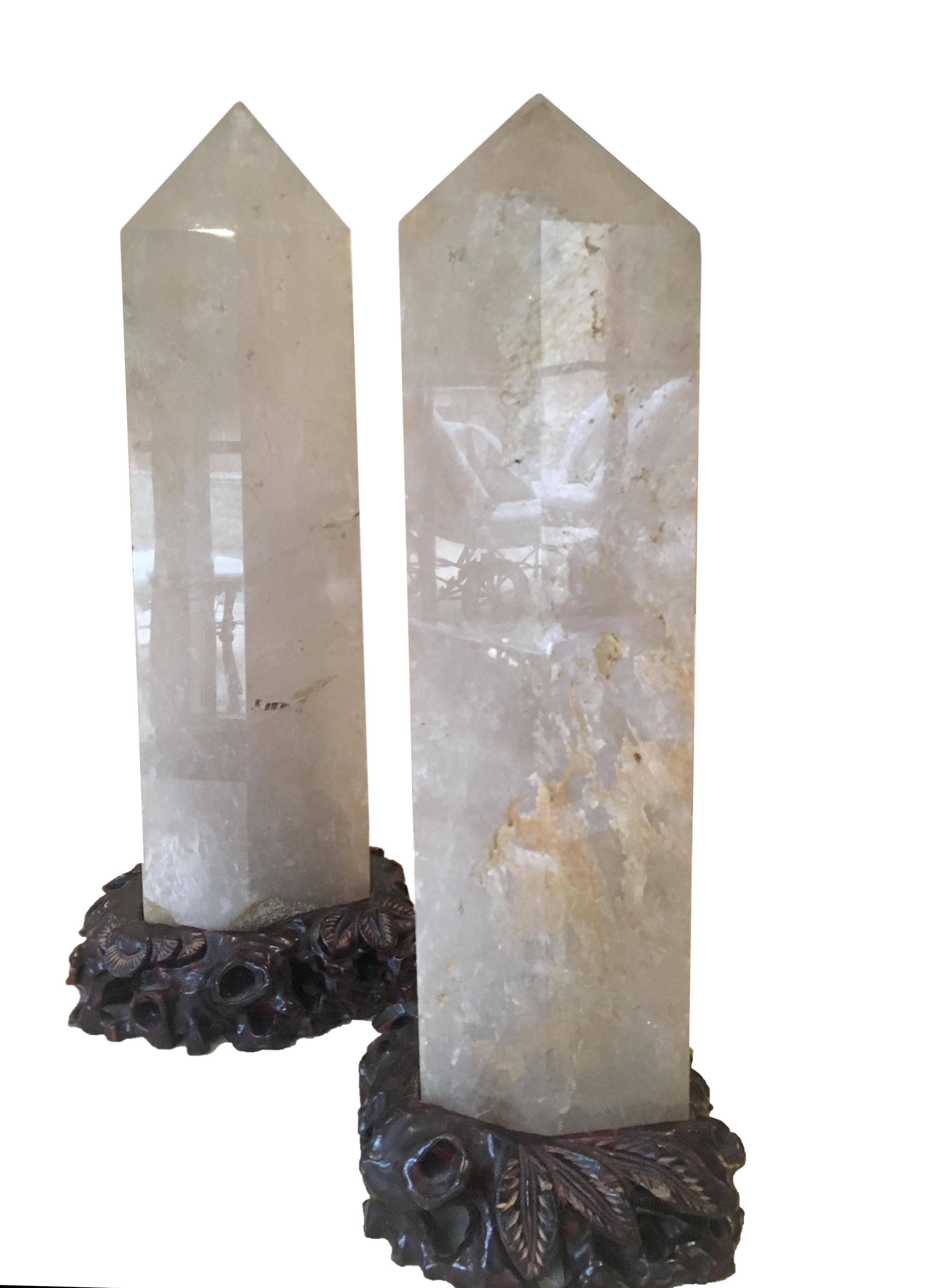 The pair of quartz rock crystal Obelisks on custom hand-carved wooden stands.
Dimensions:
6