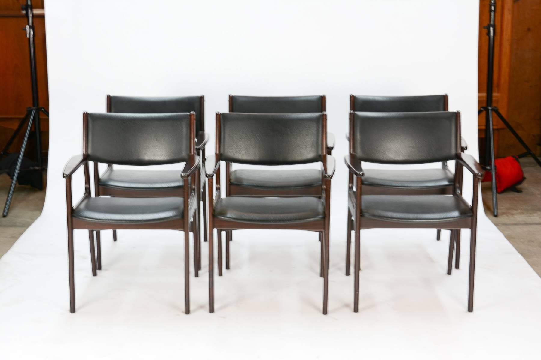 A Classic and stately armchair by Danish Mid-Century designer Erik Buch (often referenced as Erik Buck in Great Britain and the U.S.) In rosewood with original black leather upholstery.

Listed price is for set of six. Also available in pairs.