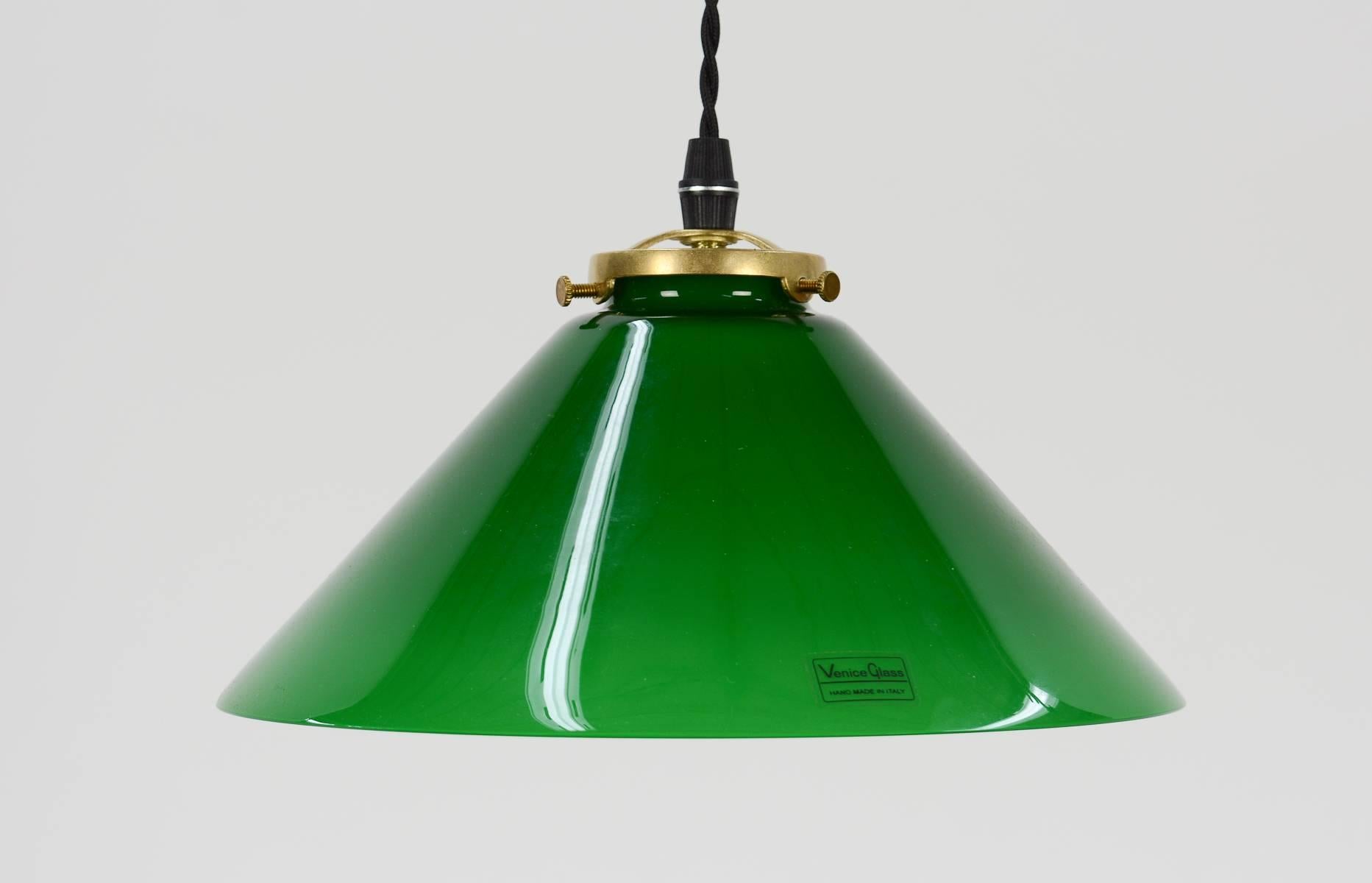 A wonderful trio of Venetian green glass pendant lamps ready to introduce a dash of color, simplicity and elegance to any setting.

Freshly rewired with new sockets with dimmer switches and a drop of 5 feet of braided cord. Thanks to the glass