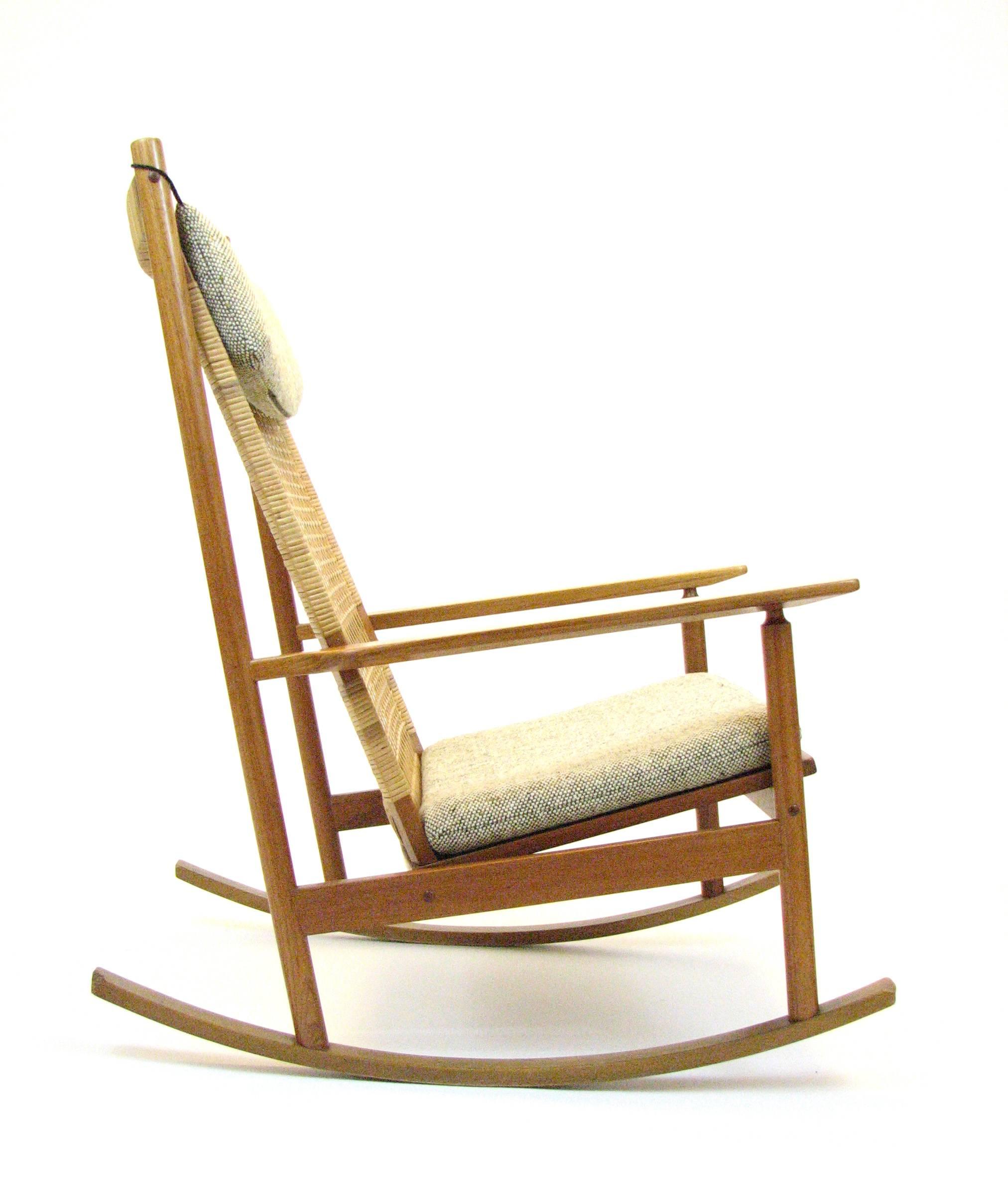 A stunning teak and woven cane rocking chair by Hans Olsen for Brdr Juul-Kristensen. Model 532A, circa 1961.

Overall beautiful condition and structurally sound. All of the caning is intact. The end of one rail has been lightly damaged, as