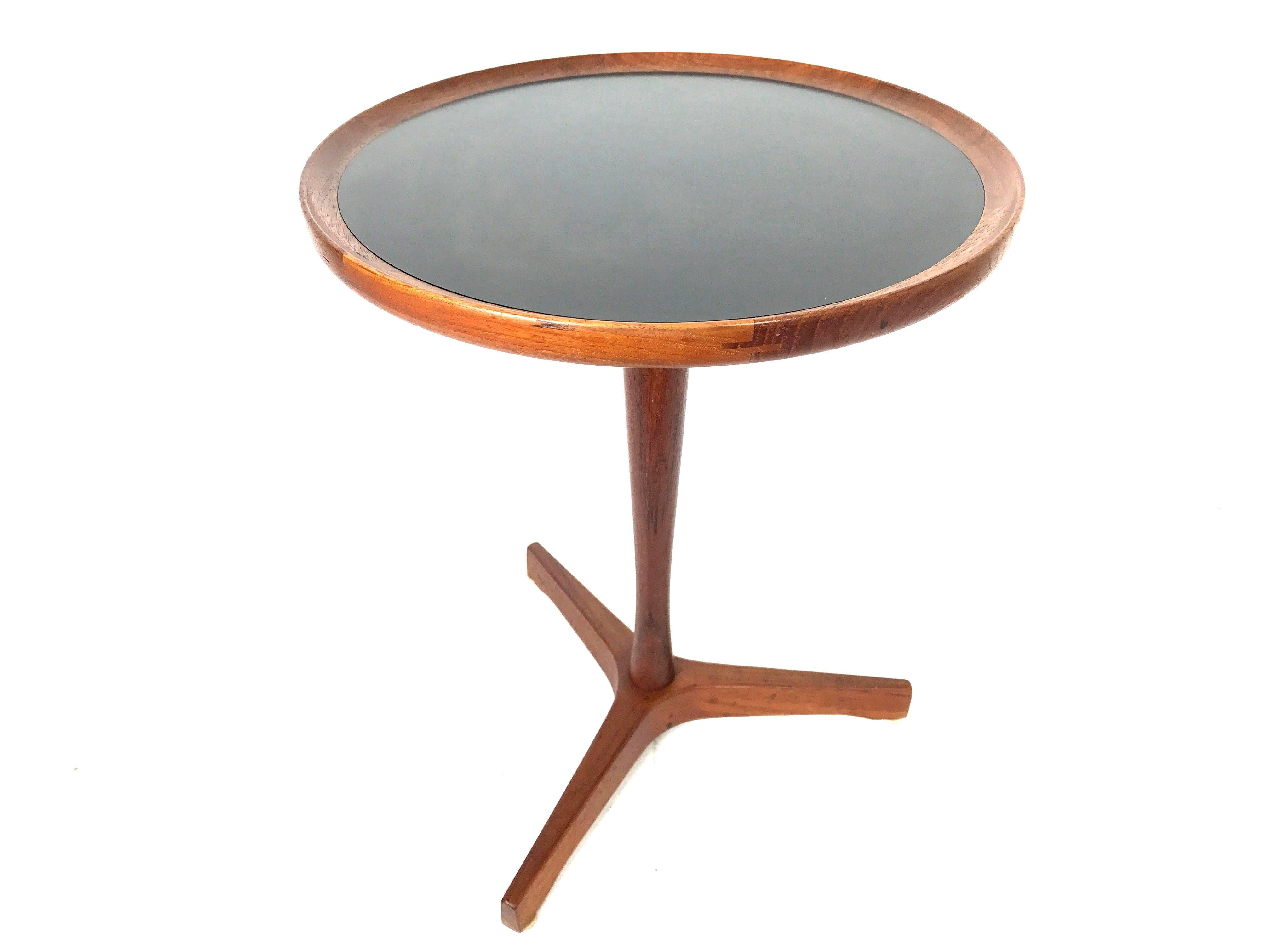 Hans Andersen side table, Denmark, 1950s. Beautiful Mid-Century simplicity. 
Signed and in mint condition. Teak wood with black veneer inlay and tripod base. 

Measures: 18" tall x 14.5" diameter.

 
