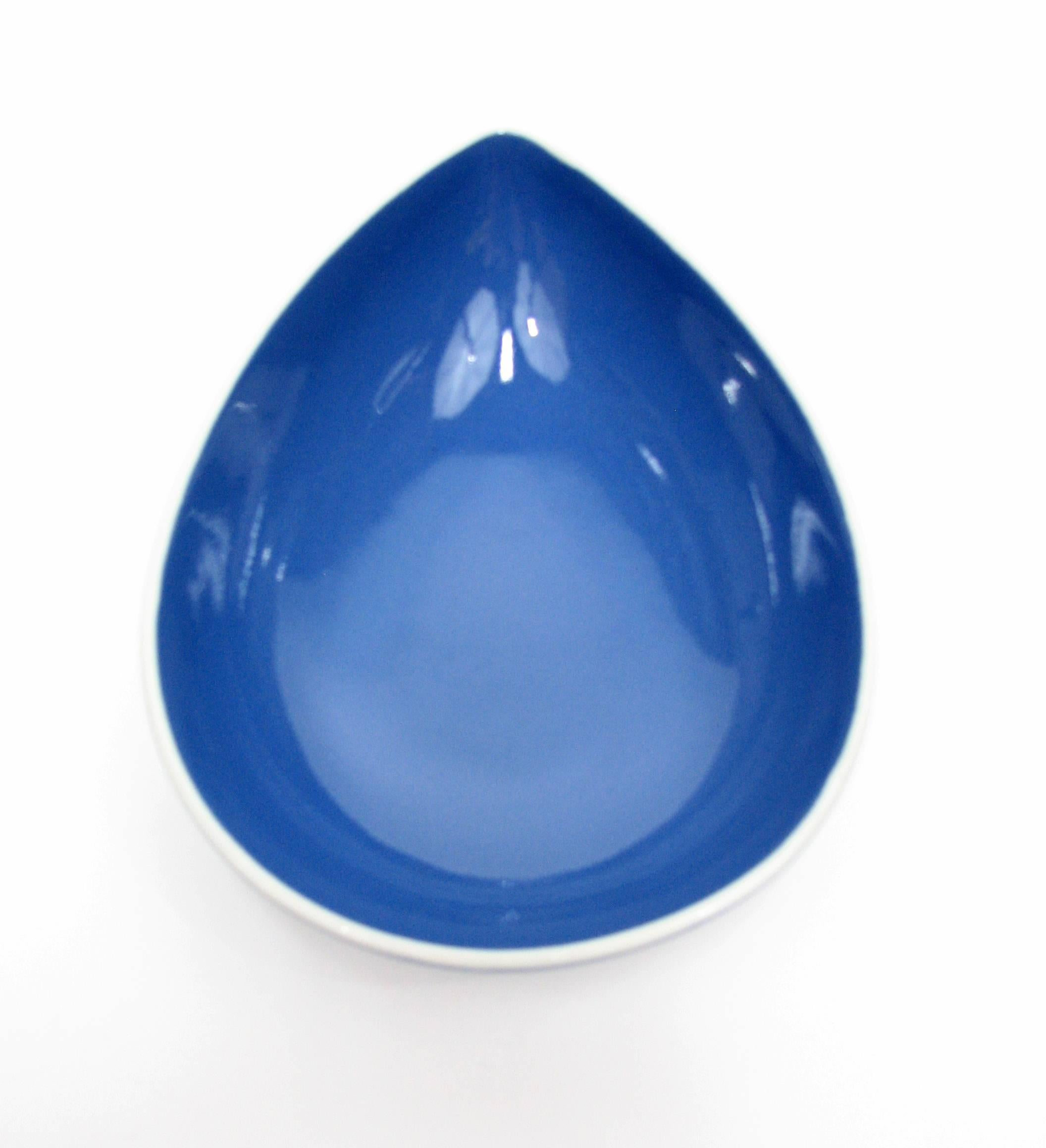 Remarkably pristine and beautiful, this blue teardrop bowl was designed by Stig Lindberg for Gustavsberg. Created in the late 1950s-early 1960s, it's in stunning shape for its age.

Stig Lindberg was a Swedish ceramic designer, glass designer,