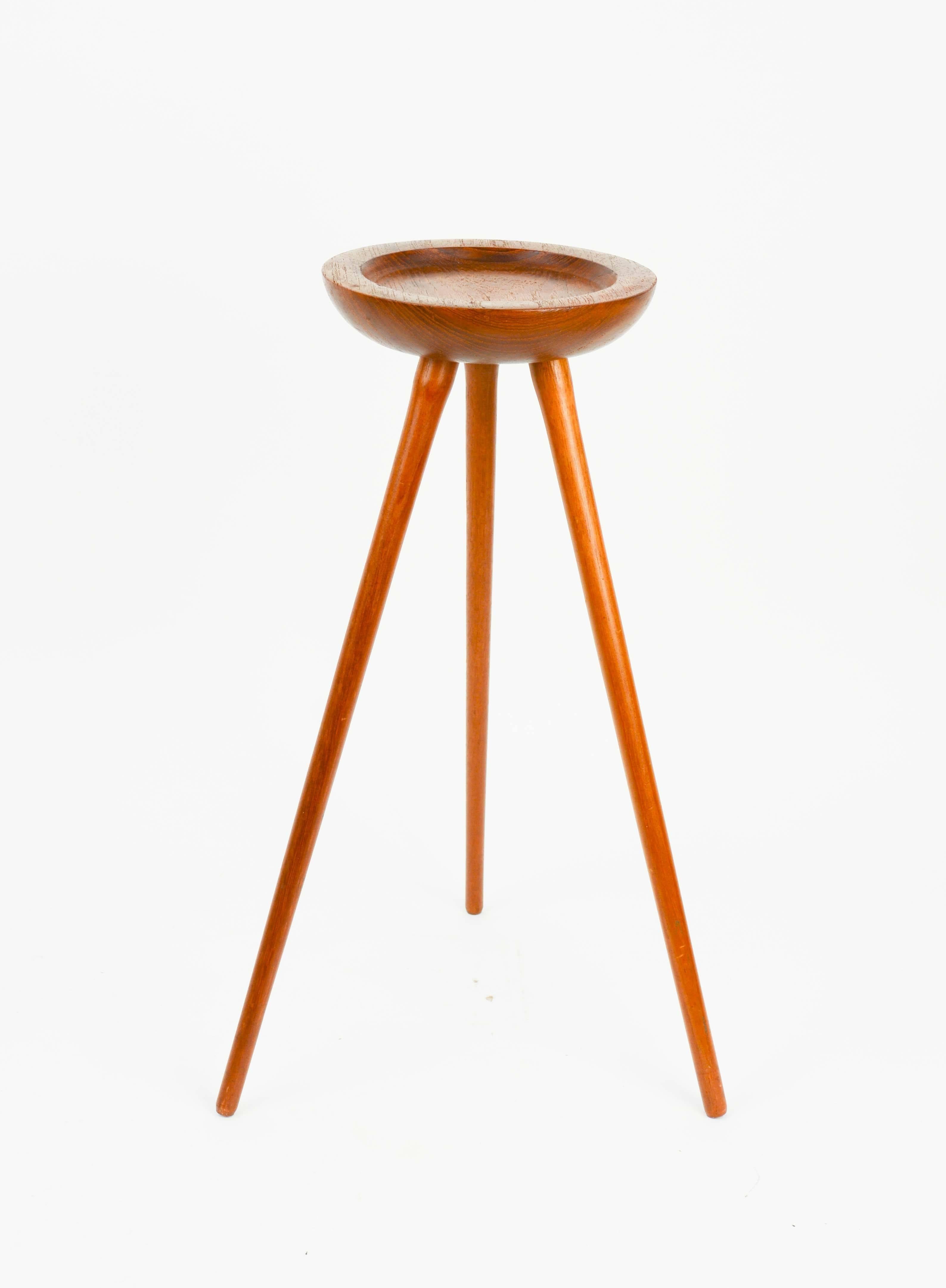 For the evening where you just want to rest and put your drink down. We have this tripod single cocktail table from Denmark in walnut.