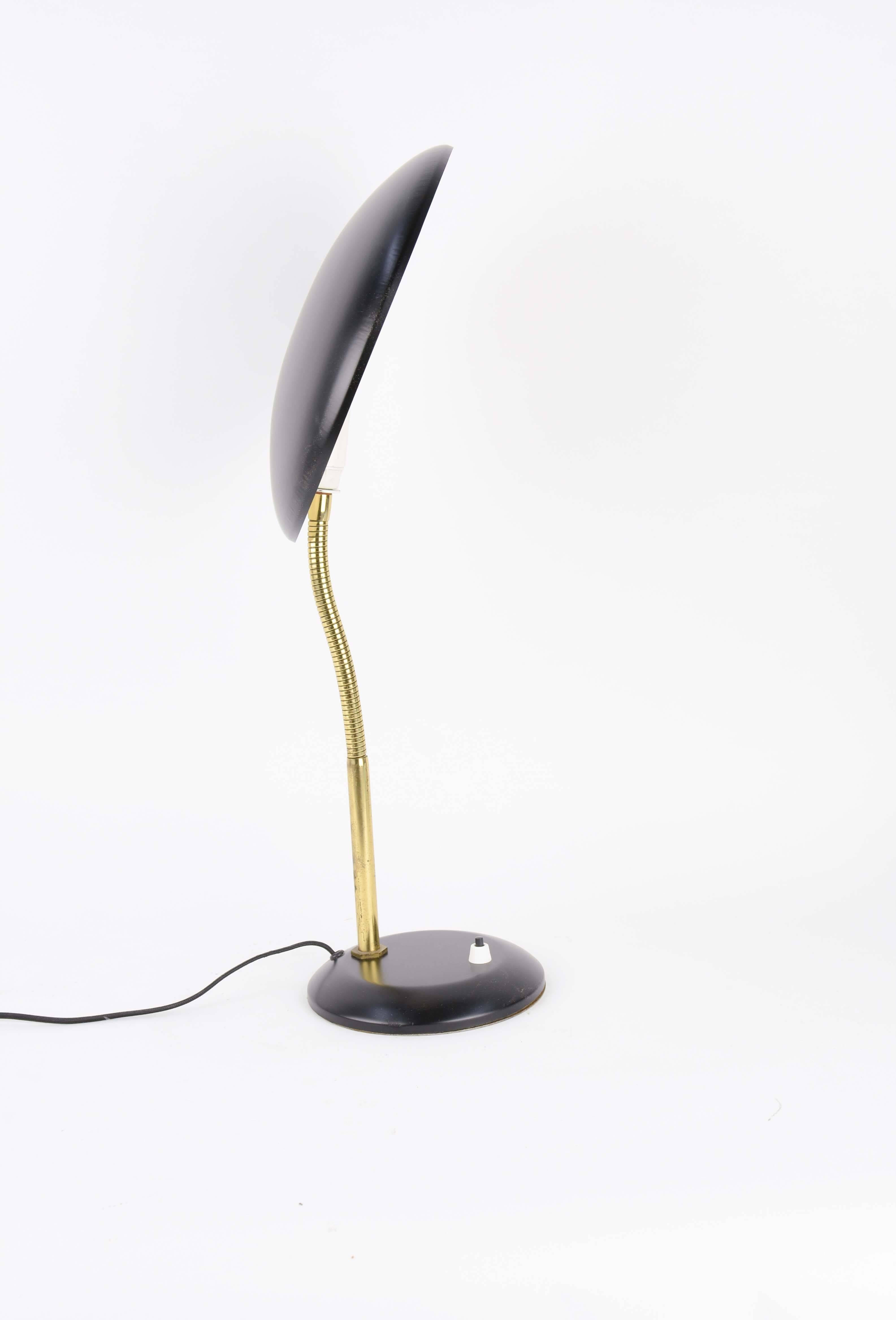 Imported from France is this gooseneck desk lamp with flying saucer light shade in black paint. Measure: 23