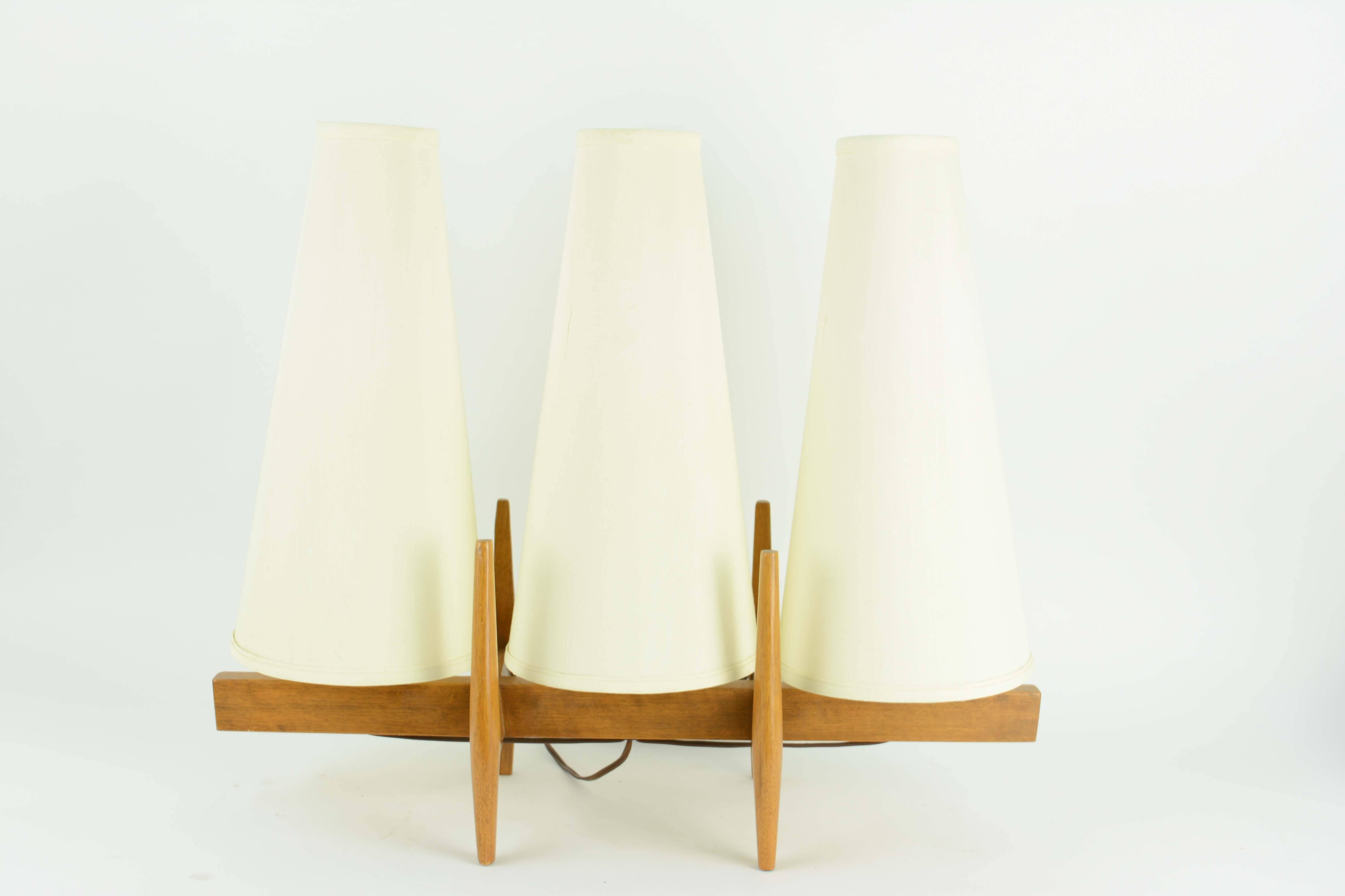 A triptych table lamp by Moss Lighting of San Francisco. The lamp is multi switching from the centre light. Right, left centre or all lights can be on.