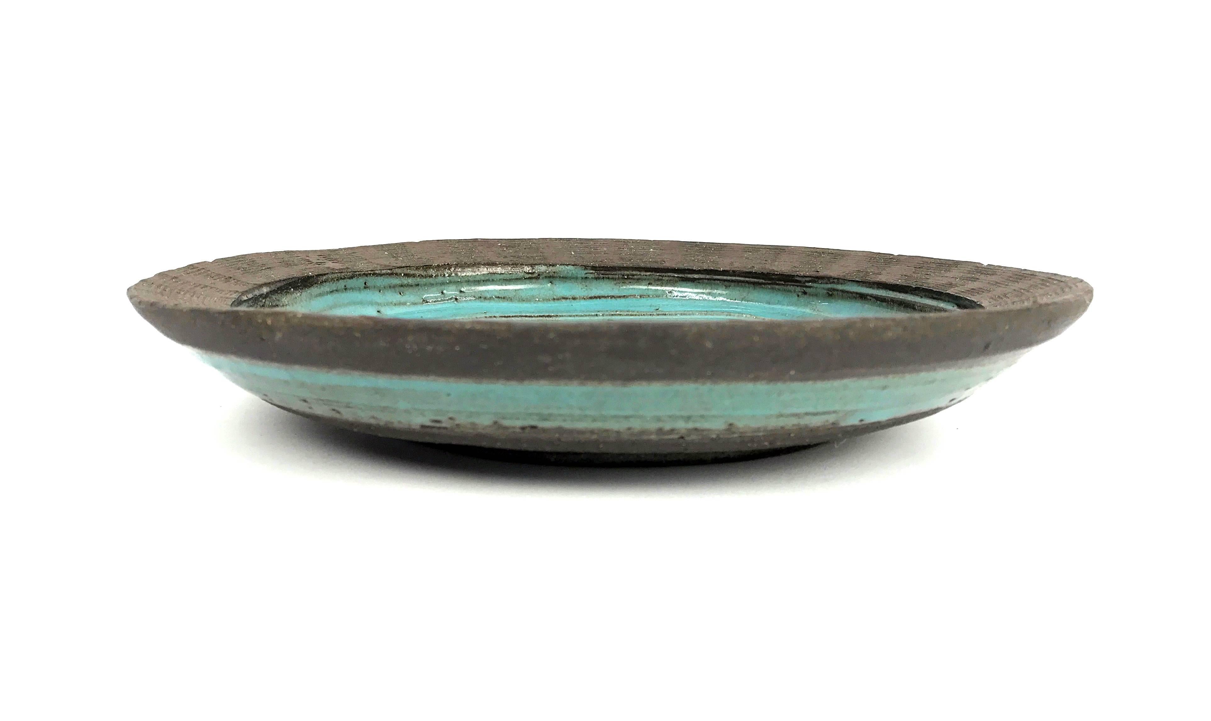 This beautiful ceramic bowl in classic 1960s aqua and earth tones was created by Mary Grote.

We know little about Mary Grote as an artist, but - interesting especially because of their name similarities - this piece seems to have been created in