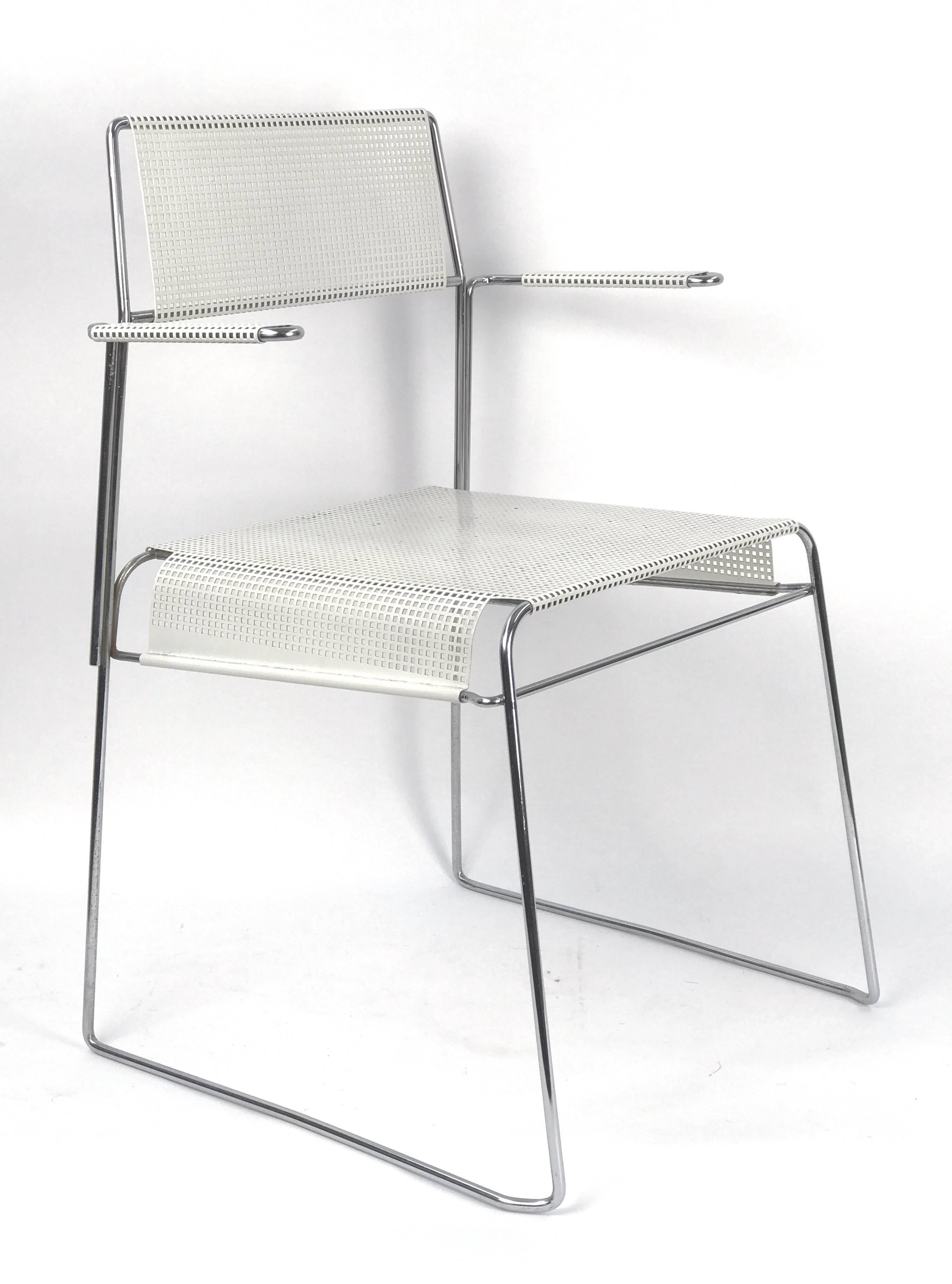 A dramatically handsome Mid-Century armchair in perforated white enameled metal on a polished chrome steel frame, in the manner of French designer Mathieu Matégot. Circa 1970s.

Armrest height 25.5 in.