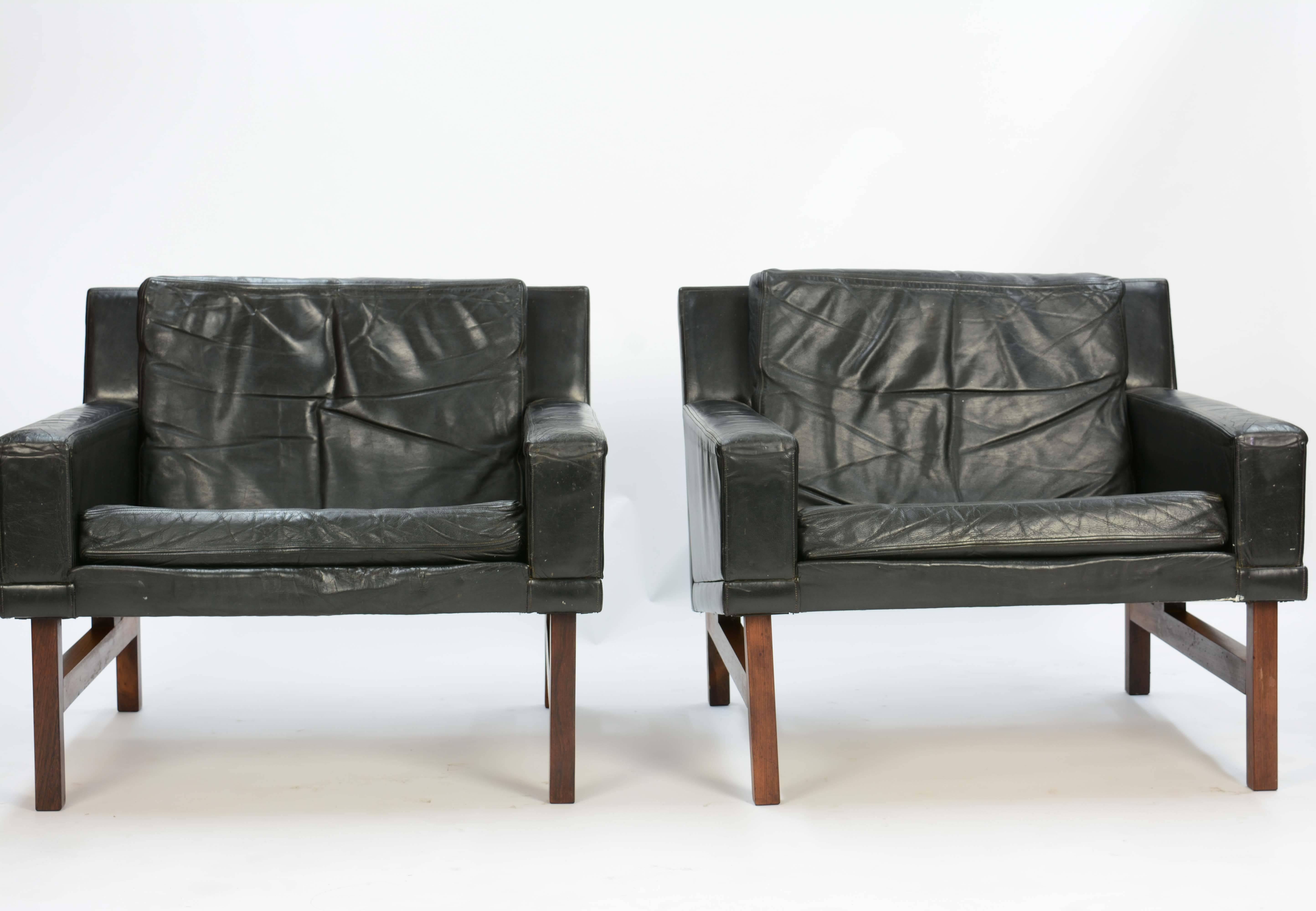 Rolschau Mobler's Club Chairs in distressed leather and floating rosewood frames by Sven Ellekaer.