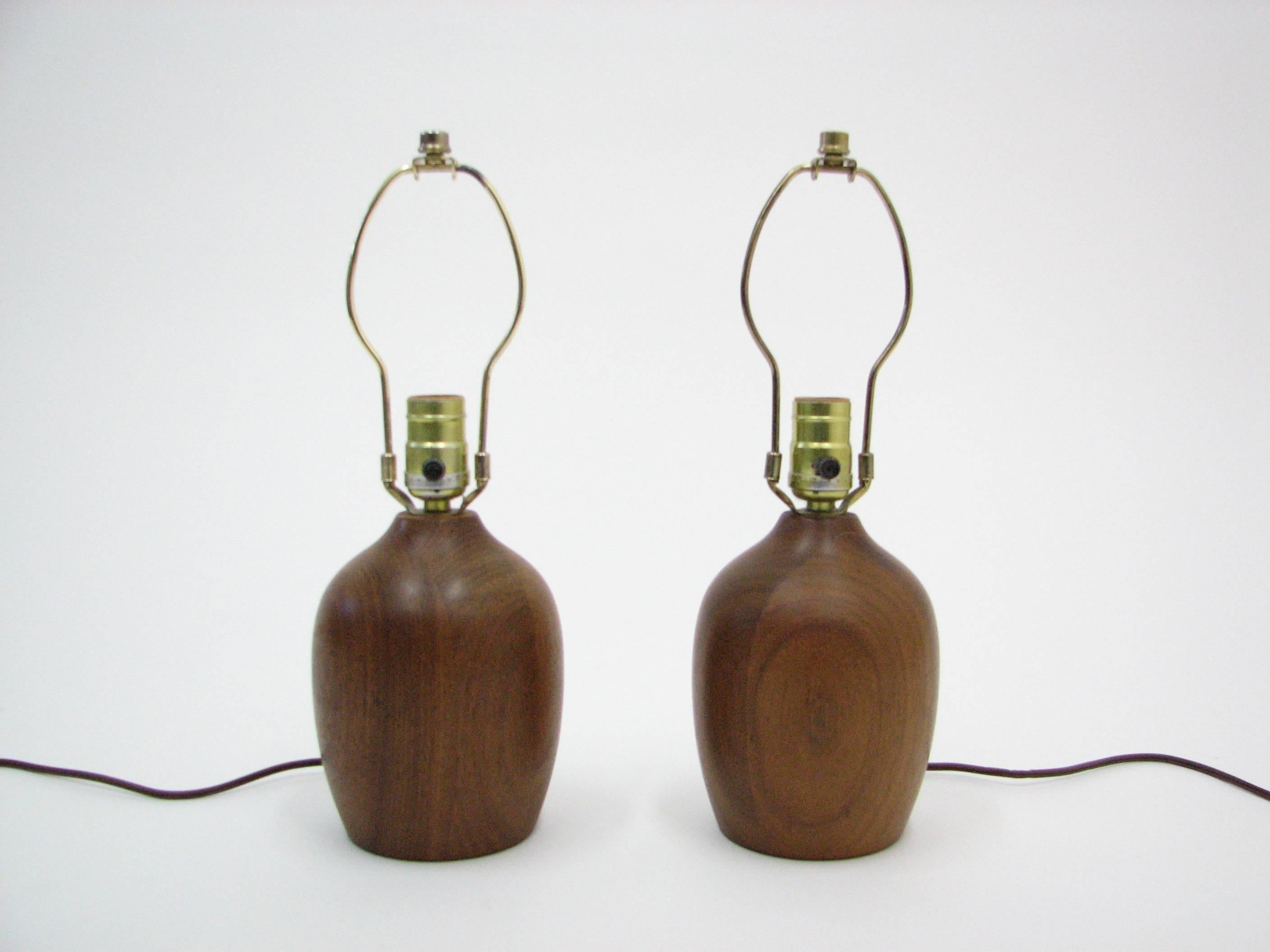 A powerhouse pair of well-crafted petite teak lamps.

Shades are pictured for demo purposes only.  We do not have shades available for these lamps.

Please note:  Pickup for these lamps is in Denver, Colorado.
