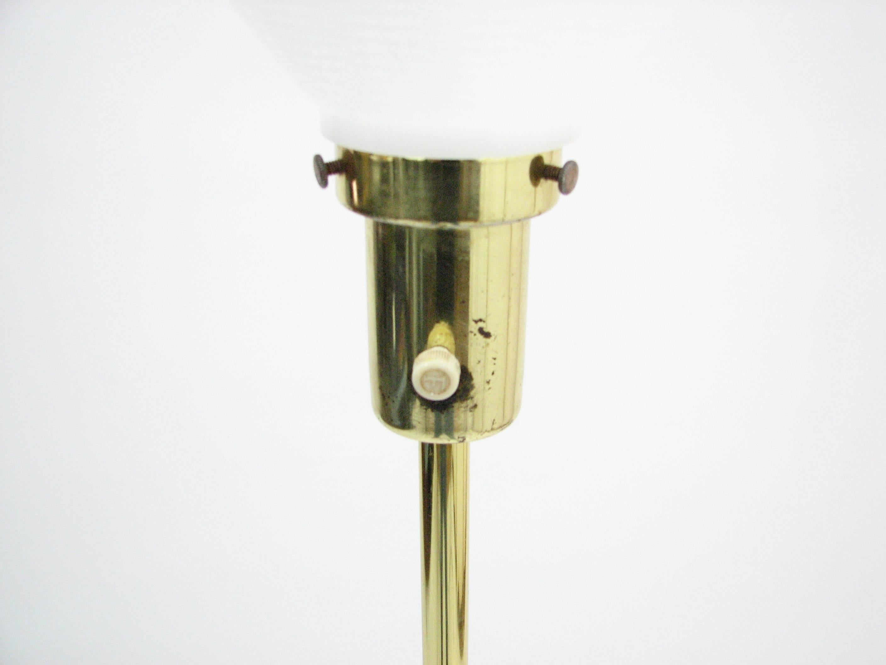 Polished Laurel Brass Tripod Floor Lamp For Sale
