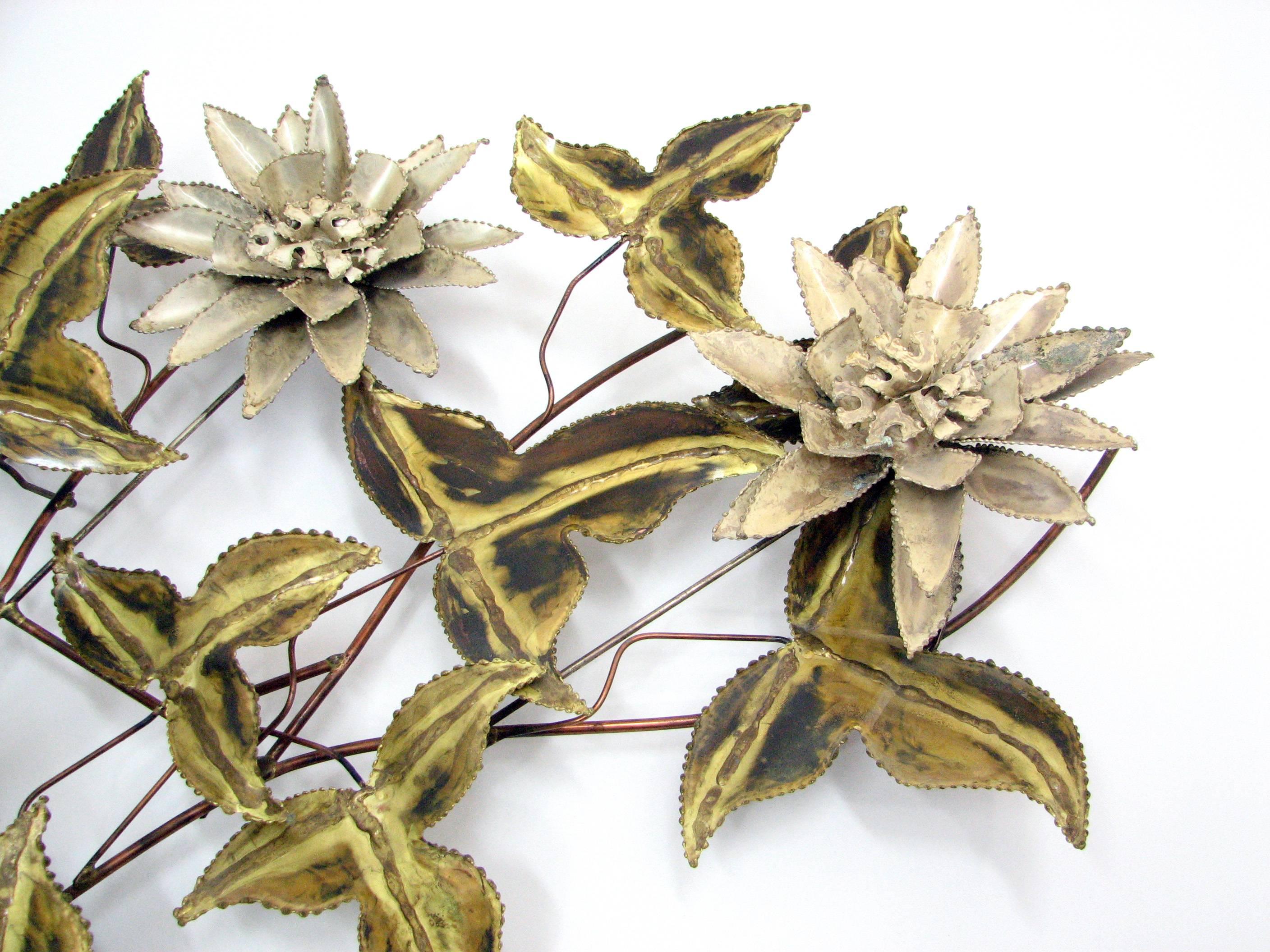 A rare and striking brutalist floral wall sculpture attributed to Curtis Jere. Steel leaves and flowers on a copper wire frame. Unsigned.

Weight: 7lbs.

Please note: Pickup for this sculpture is in Denver, Colorado.