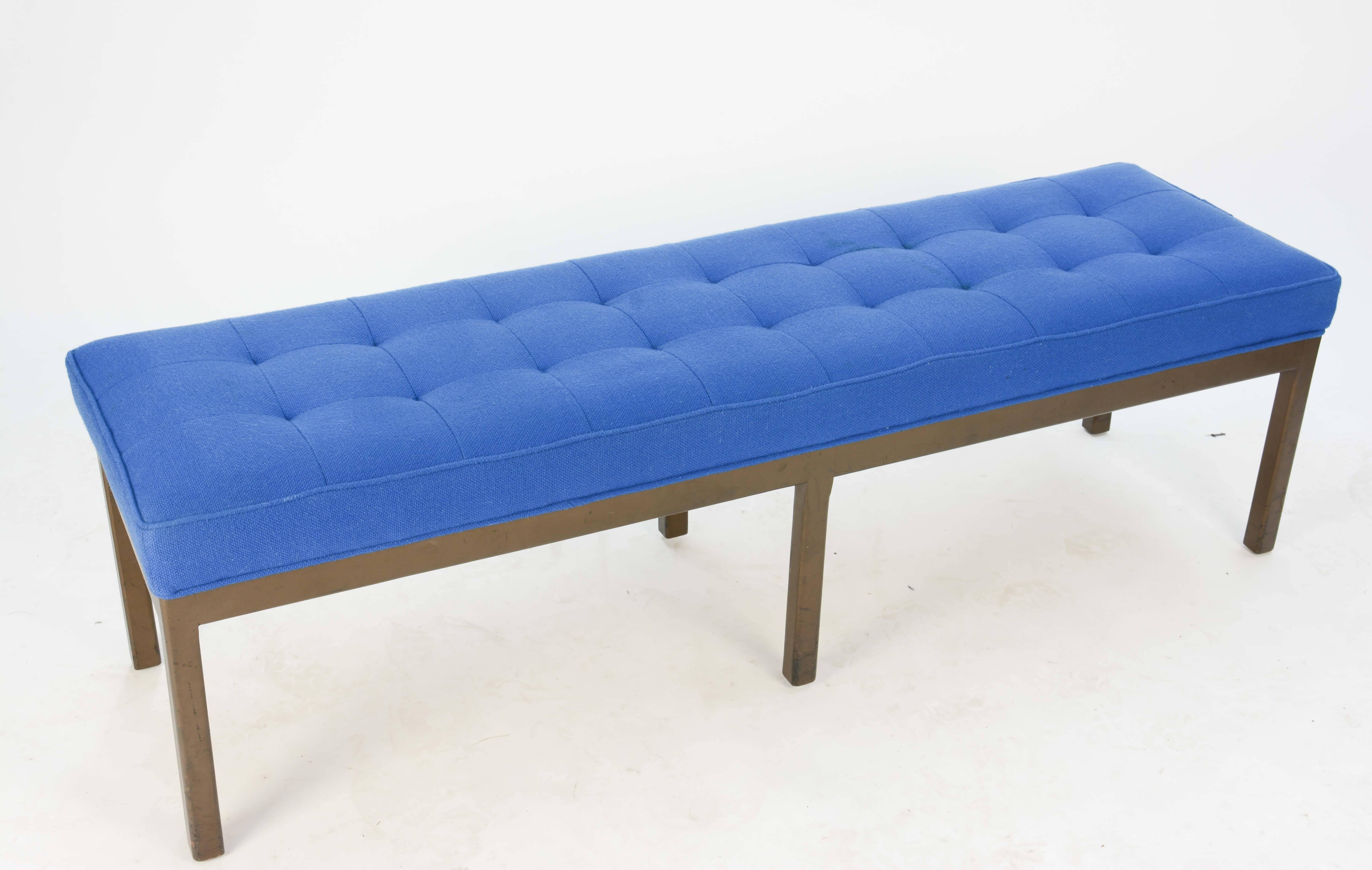 A wonderful tufted bench after Harvey Porbber in walnut and royal blue wool. This bench is wonderful and simple in design. It is excellent for the end of a bed or entry way.