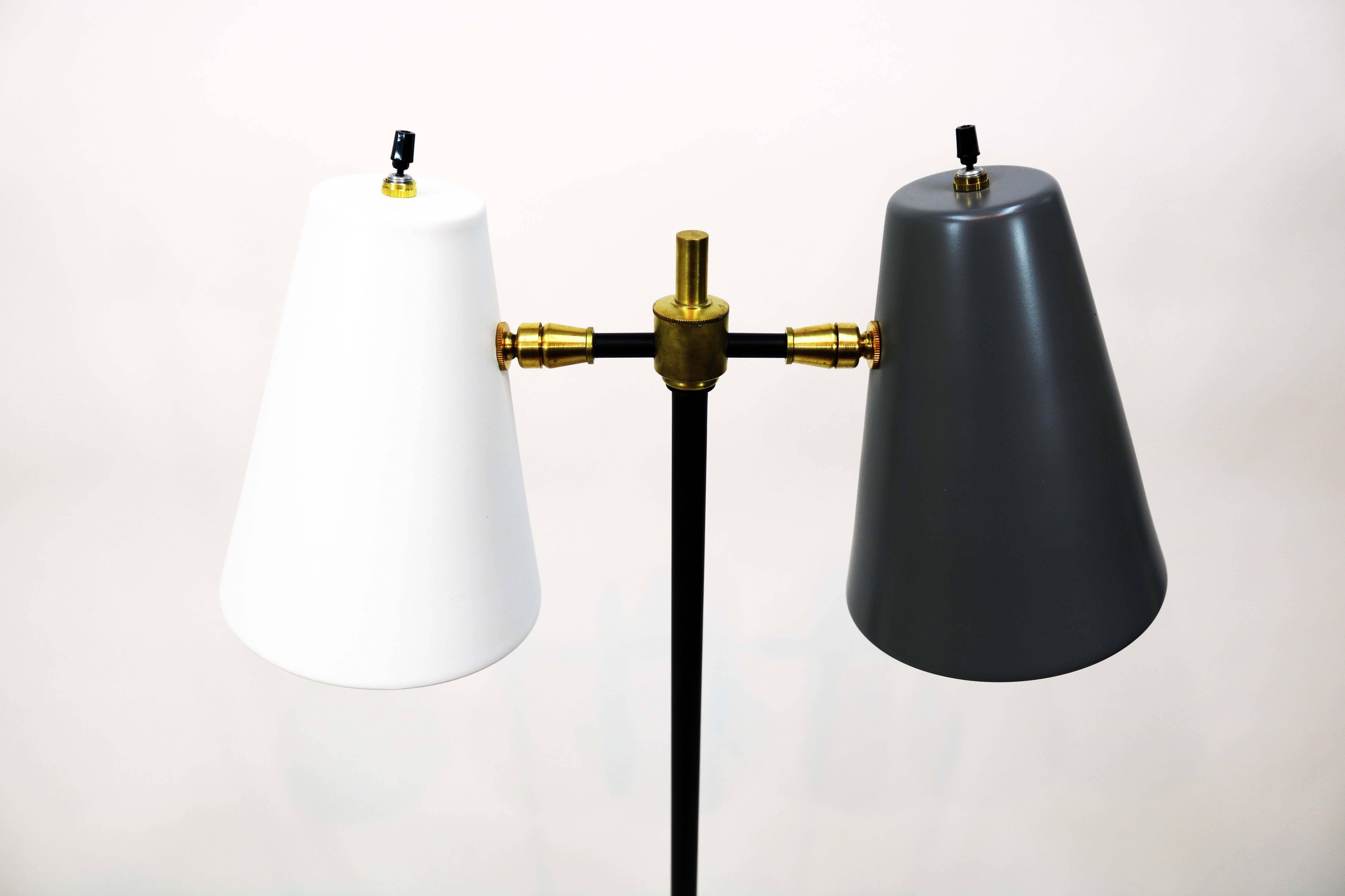 A recently restored midcentury double cone floor lamp. One cone in white, the other in charcoal on a black painted metal base with brass detail. Provenance unknown.

Please note: Pickup for this lamp is in Denver, CO.