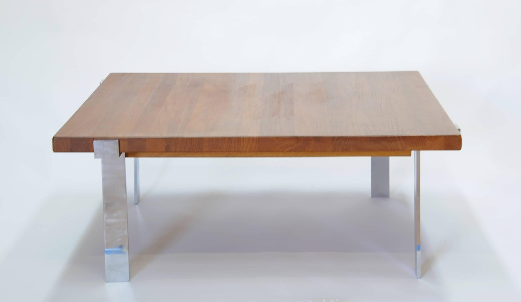 A wonderful scaled and functional coffee table by Illum Wikkelsø for A. Mikael Laursen. The solid teak top in is the butcher block style with stainless steel legs.