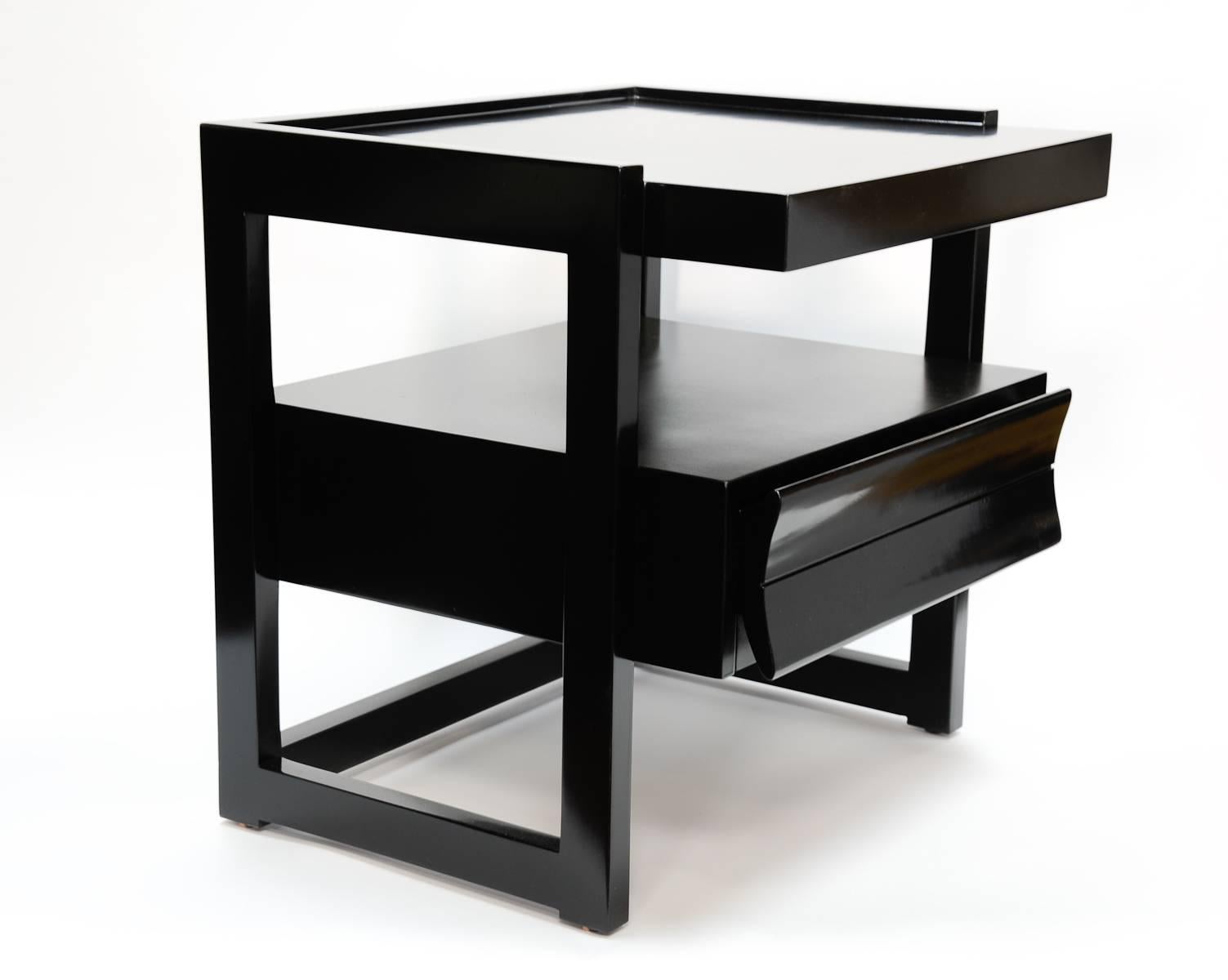 A wonderful and elegant Paul Laszlo nightstands in a black lacquer. The nightstands have been refreshly refinished.