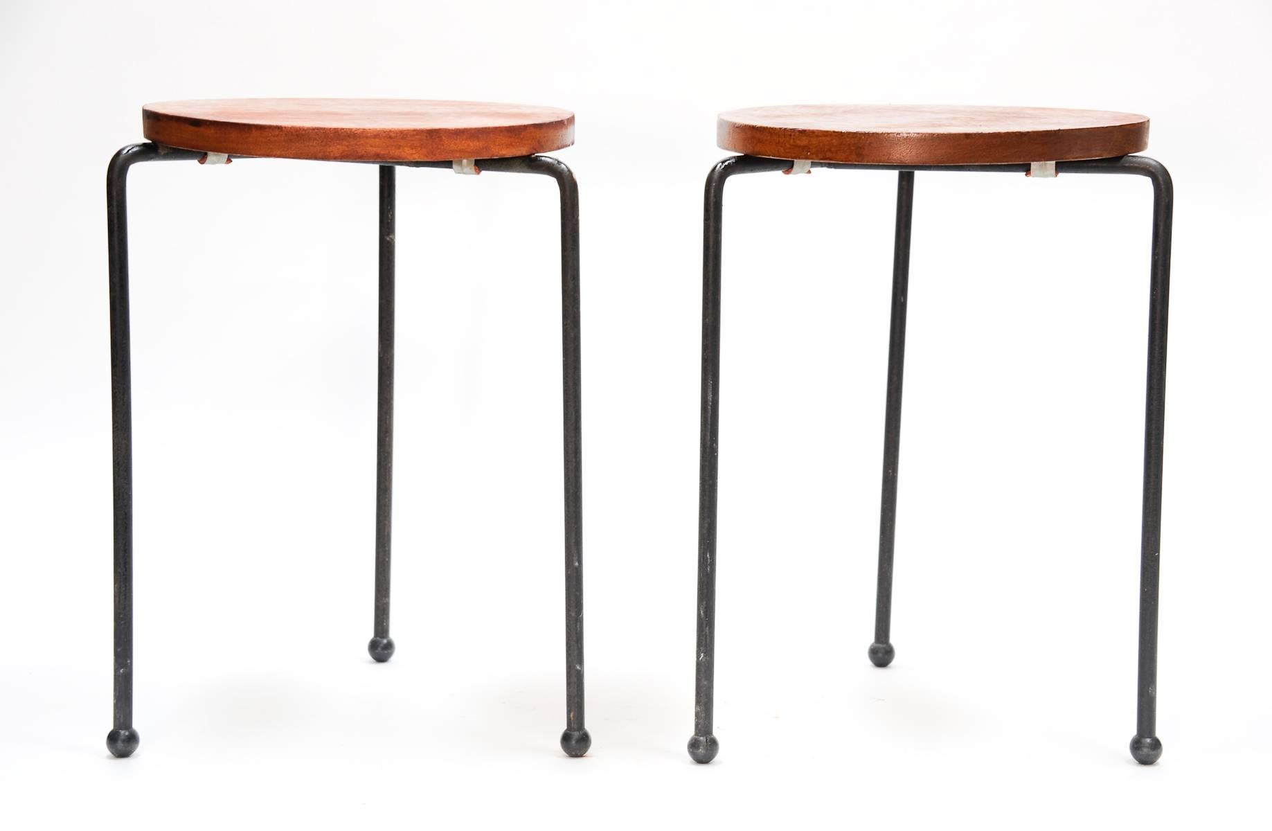 Straight from a home in Sausalito CA and brought directly from Luther Conover studios are this pair of stools in solid Mahogany and iron. The tops have been refinished. Designed for Pacific Label for California Contemporary Inc.