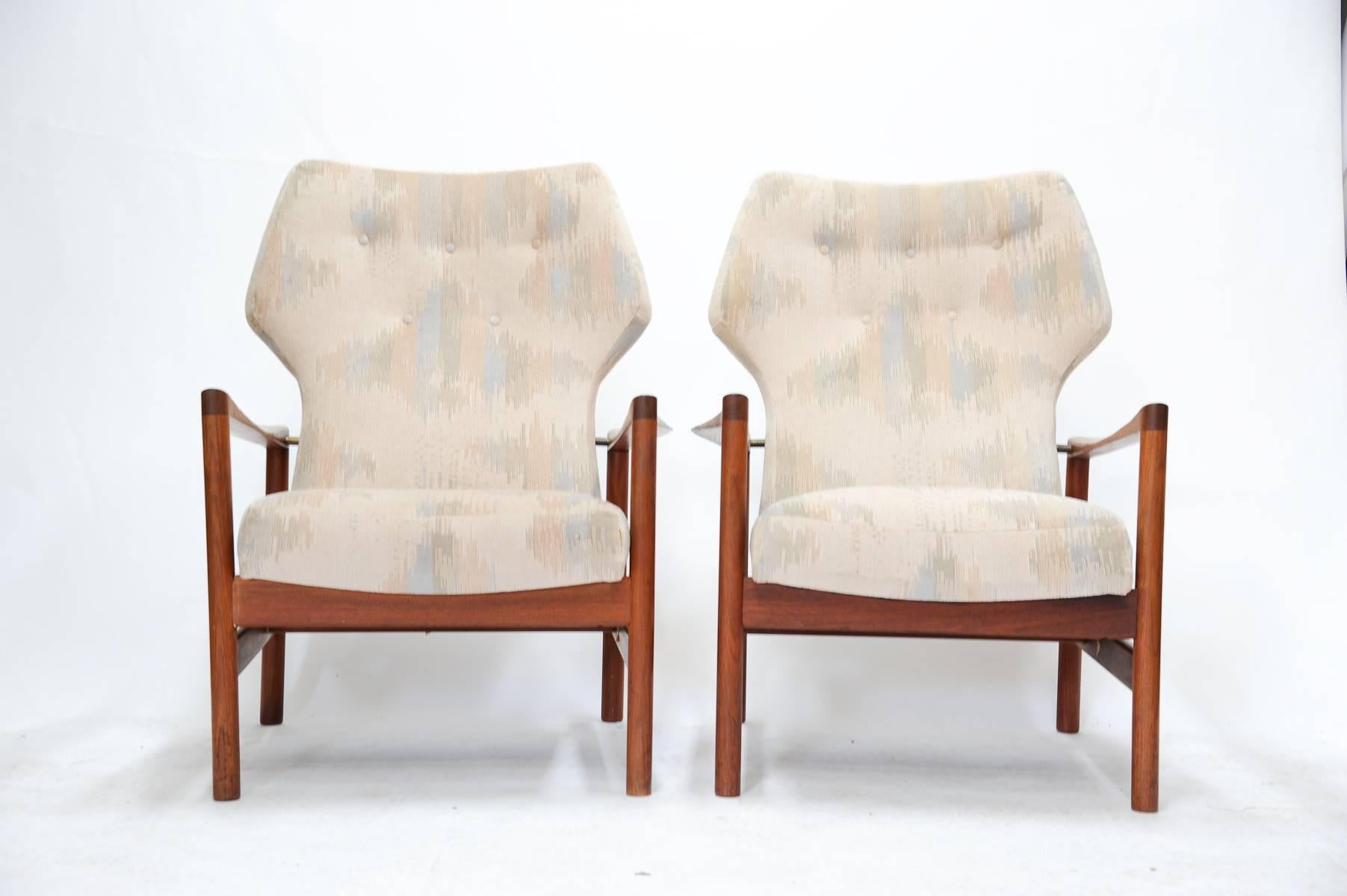 A wonderful pair of Westnofa Club Chairs by Alfred Rellings.  The chairs are finely detailed and have brass connection points.  The arms are flared and sculpted for comfort and style. Arm height is 24"