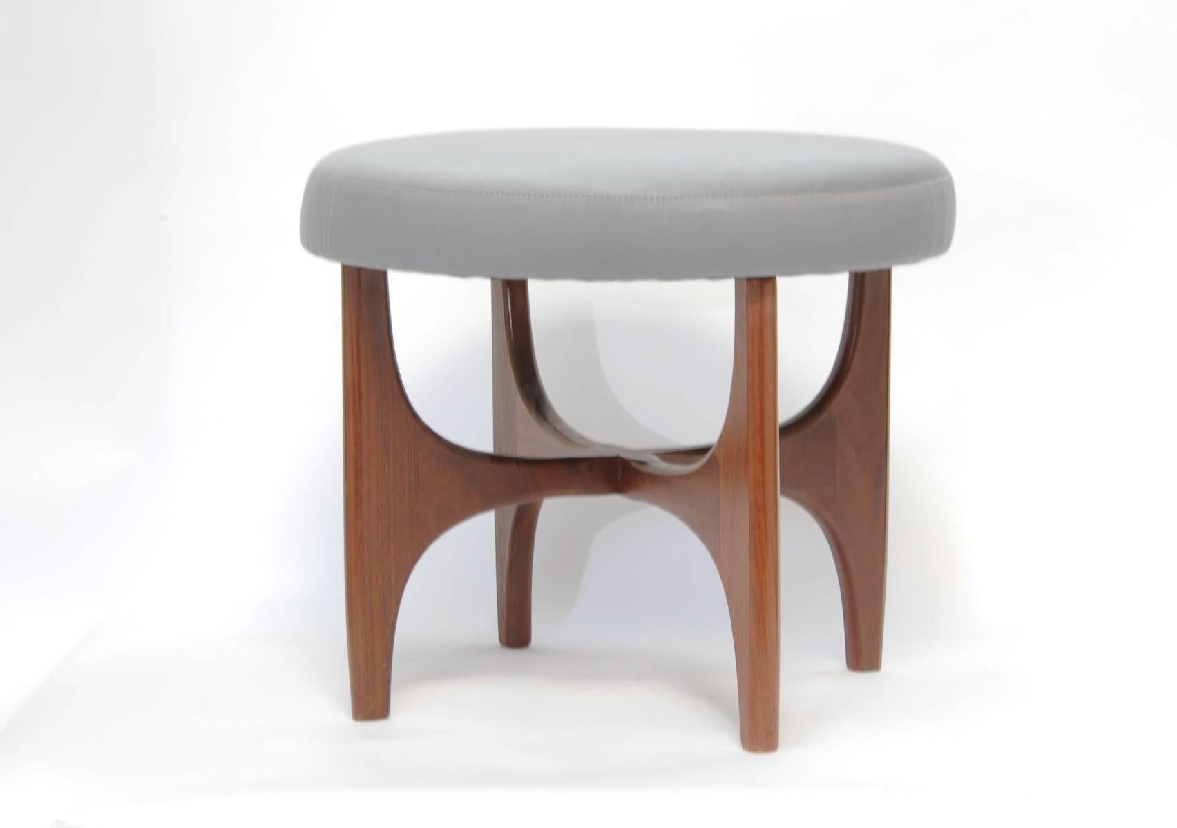 A pair of walnut stools with upholstered tops. These beauties are handsome and decorative in any room or environment.