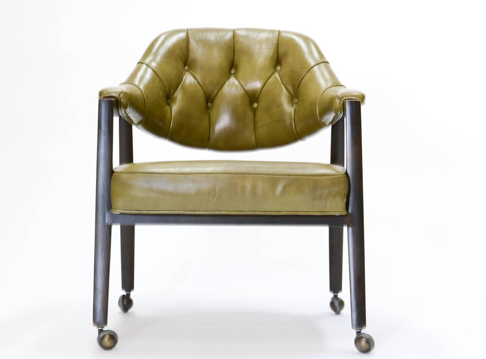 A wonderful set of up to ten Maurice Bailey swivel executive desk chairs in distressed green leather. Eight of the chairs are in green leather and two are in fabric seen in image 8.