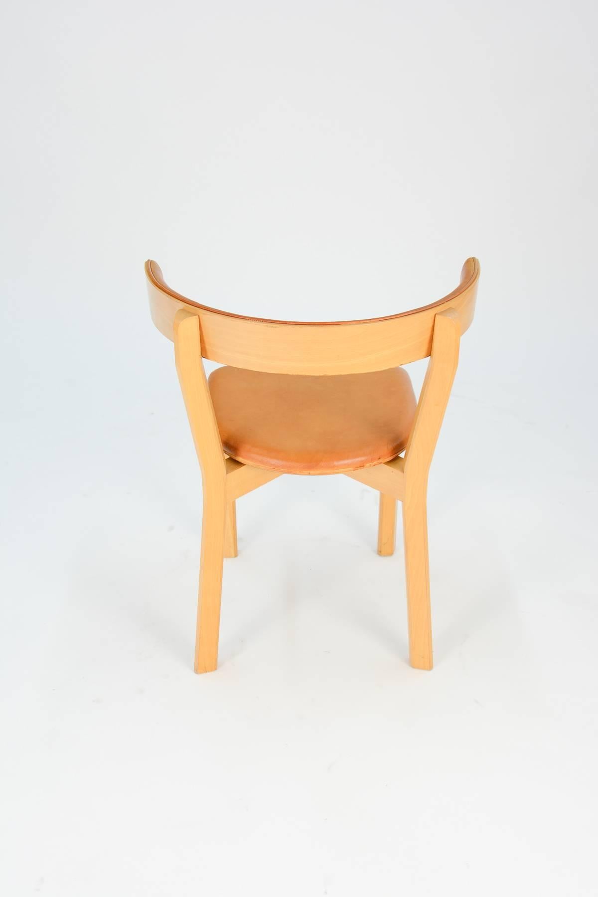 Up to 3 Jorgen Gammelgaard Surround Back Dining Chairs in Congac Leather In Good Condition In Portland, OR