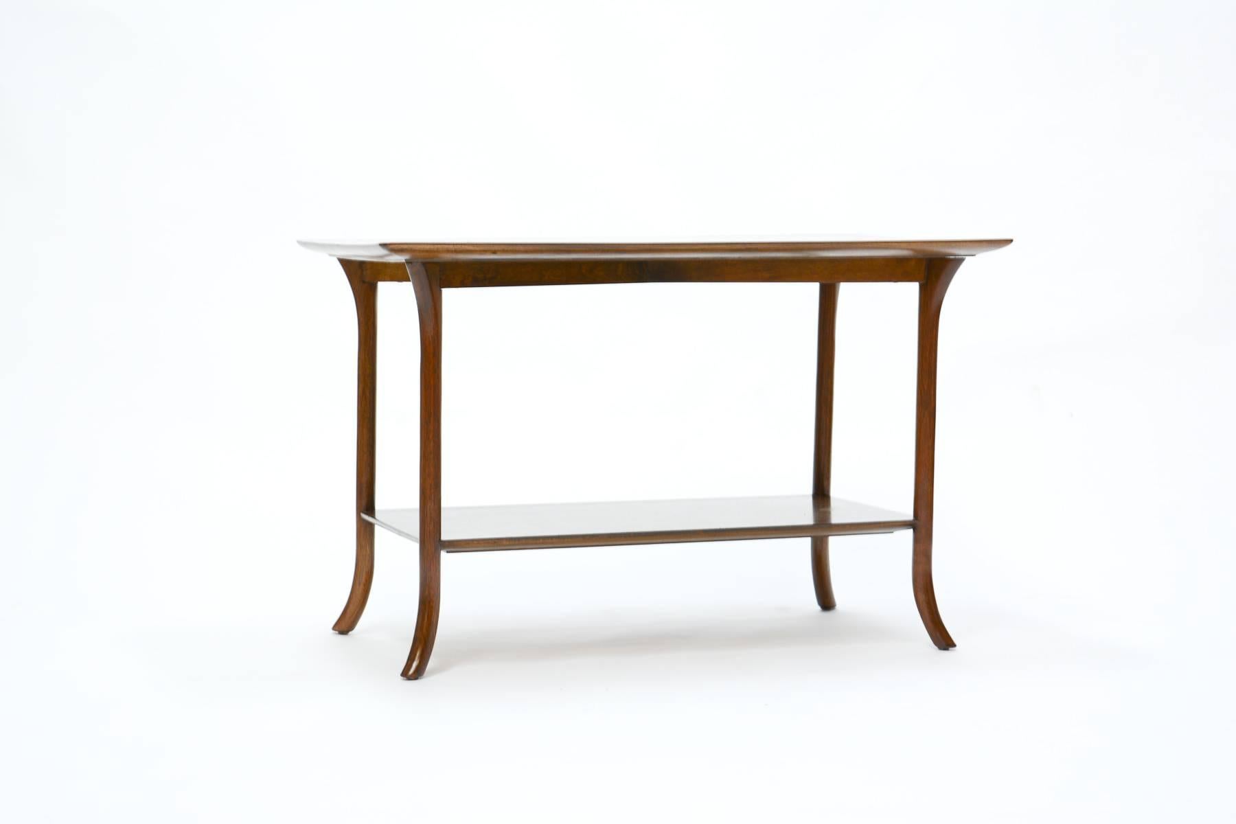 A T. H. Robsjohn-Gibbings side table for Widdicomb with crossed-veneer top.

A Classic example of Robsjohn-Gibbings' elegant Mid-Century design, incorporating simple lines found in nature and a fondness and preservation of natural materials.

T.