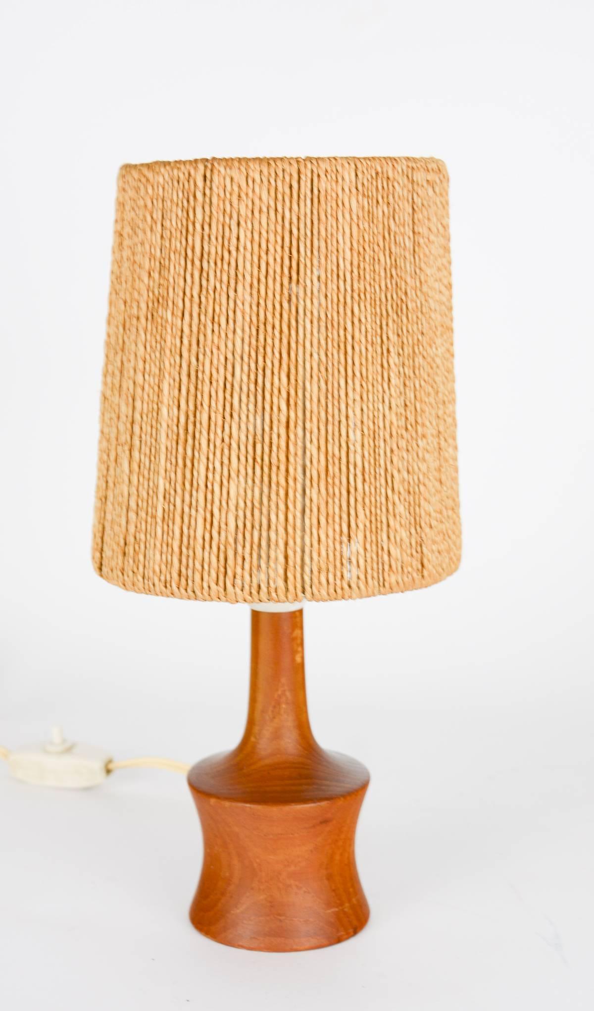 A delightful petite teak lamp with jute strand shade by Jørgen Gammelgaard.

Gammelgaard was trained as a cabinetmaker at the Copenhagen School of Arts and Crafts and served an apprenticeship at C. B. Hansen's workshop in Copenhagen, and later