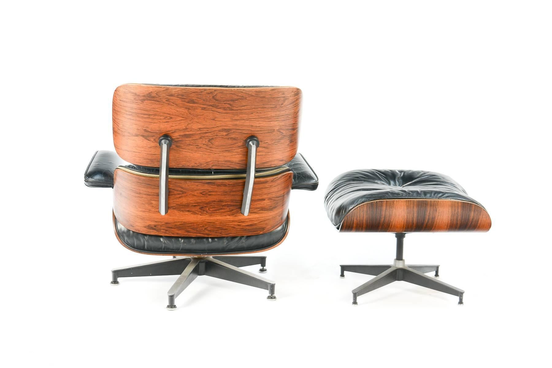 A beautiful edition of the iconic 670 lounge chair and 671 ottoman by Charles and Ray Eames for Herman Miller in rosewood. Dated "9/70", both the chair and ottoman are wonderfully grained with distressed original leather.

The ottoman