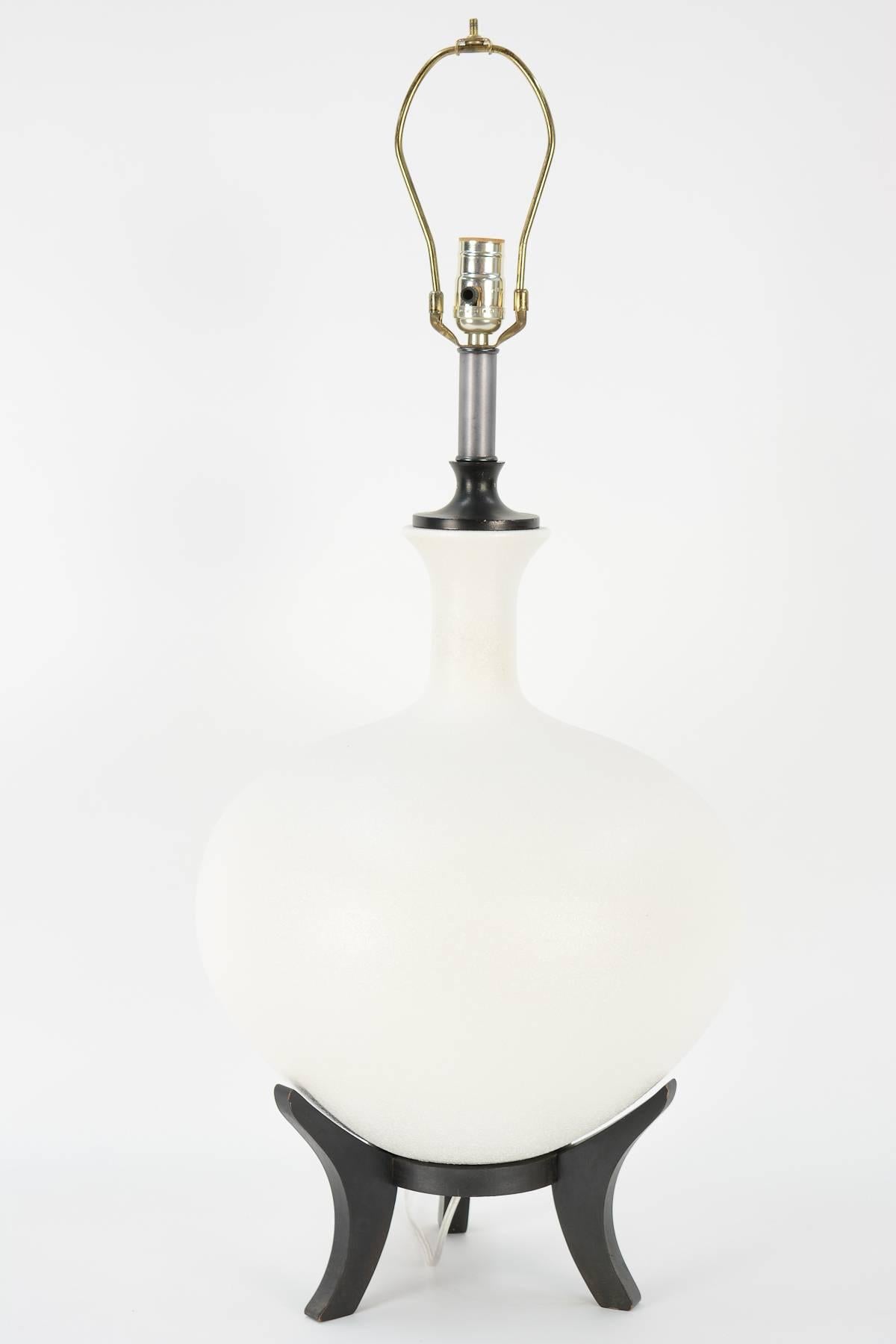 An exquisite pair of textured grand Danish ceramic lamps with floating tripod bases.

Sold without shades.
