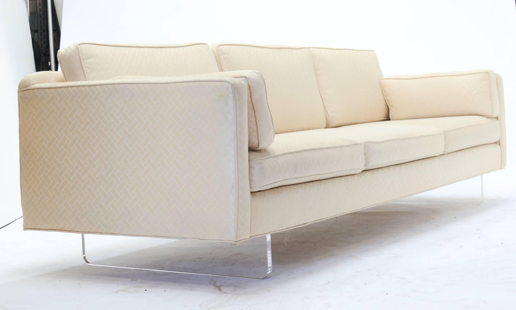 A handsomely tailored sofa with Lucite sled bases in the manner of American artist and furniture designer Charles Hollis Jones (b. 1945).

A fitting tribute to the living American genius, who established his own design firm at age 16, initiating and
