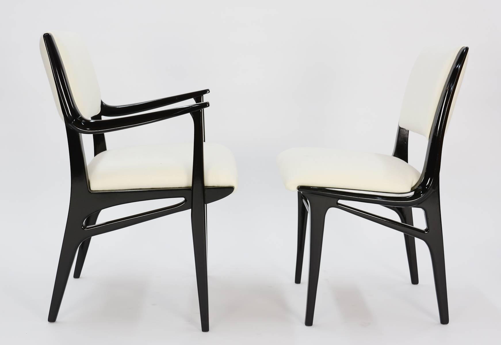 This set of ten dining chairs which include two armchairs and six sides have been black lacquered and new foam and upholstery ready muslin.

Arm height is 26