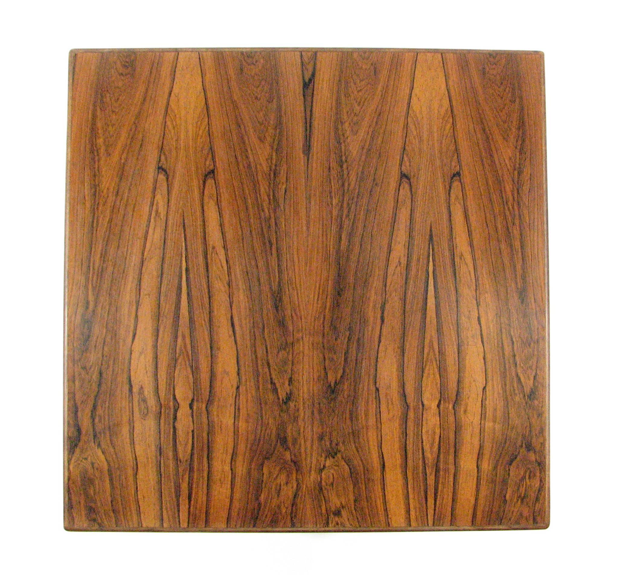 The rosewood grain in this Mid-Century table is stunningly beautiful. Sized to serve as either a cocktail table or side table. 

There are no markings, so its exact provenance is unknown.