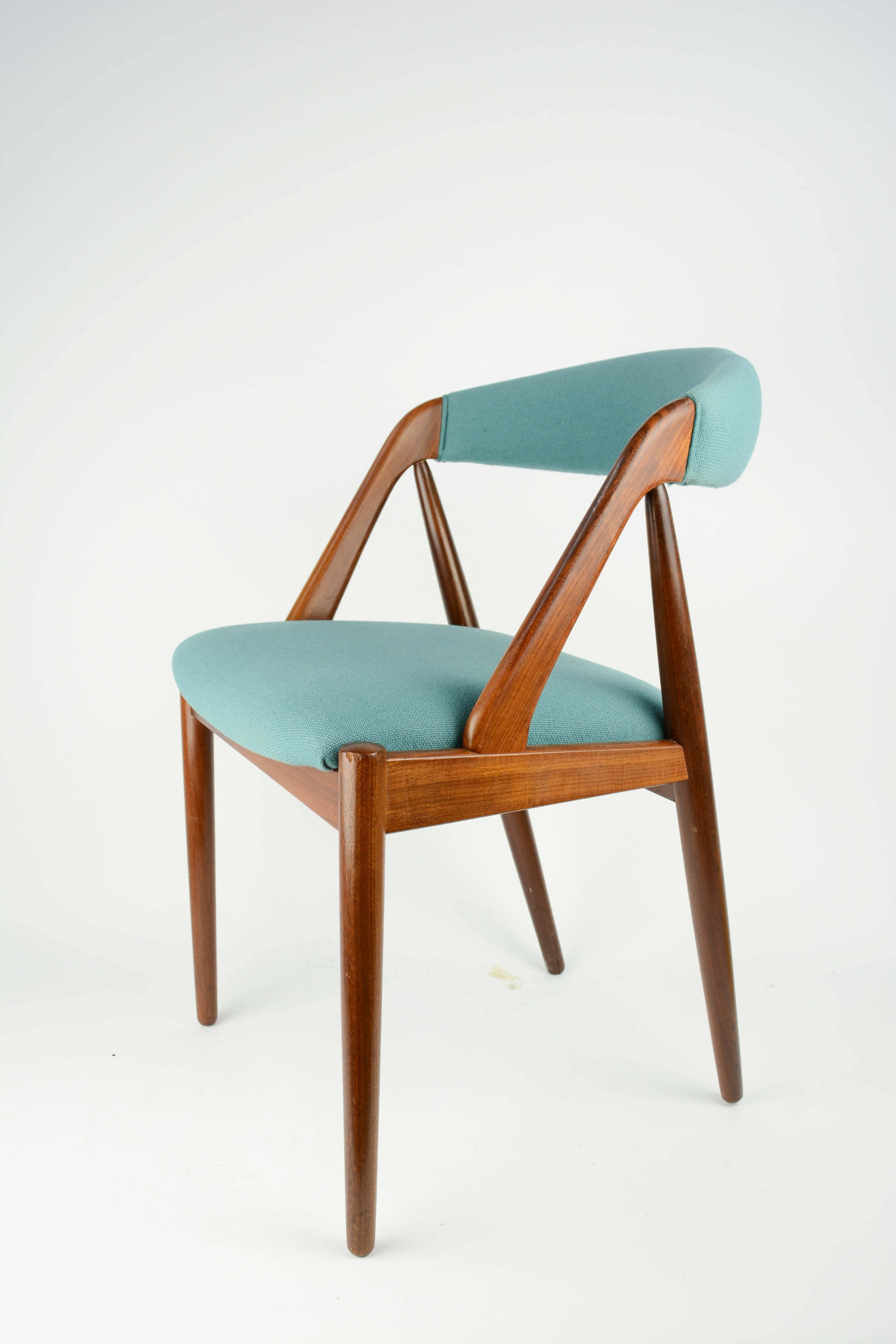 Elegant and refined set of six Kai Kristensen dining chairs in teak with Danish blue wool fabric.