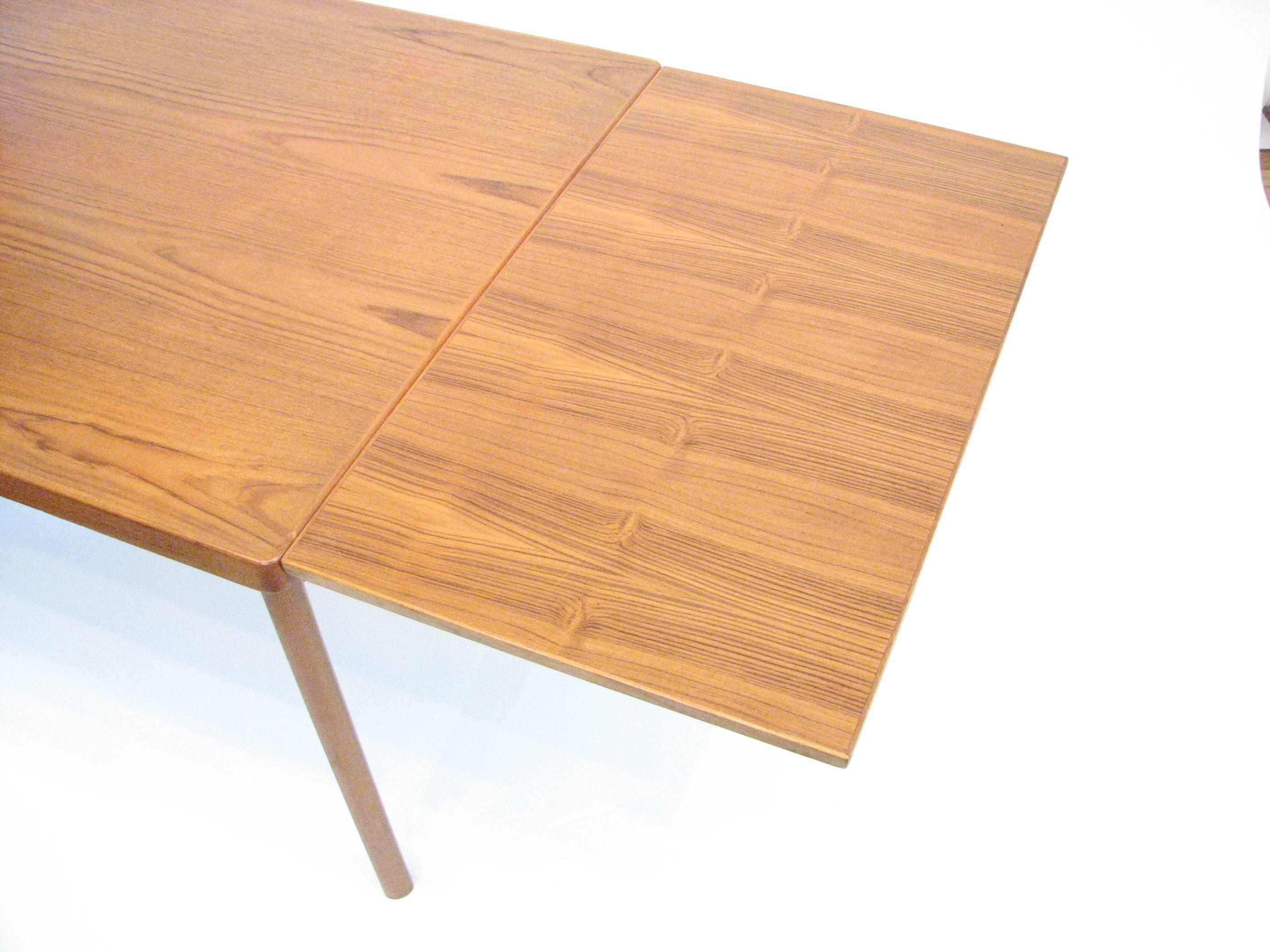 Midcentury Danish Teak Dining Table with Pull-Out Leaves by Henning Kjærnulf In Good Condition In Portland, OR