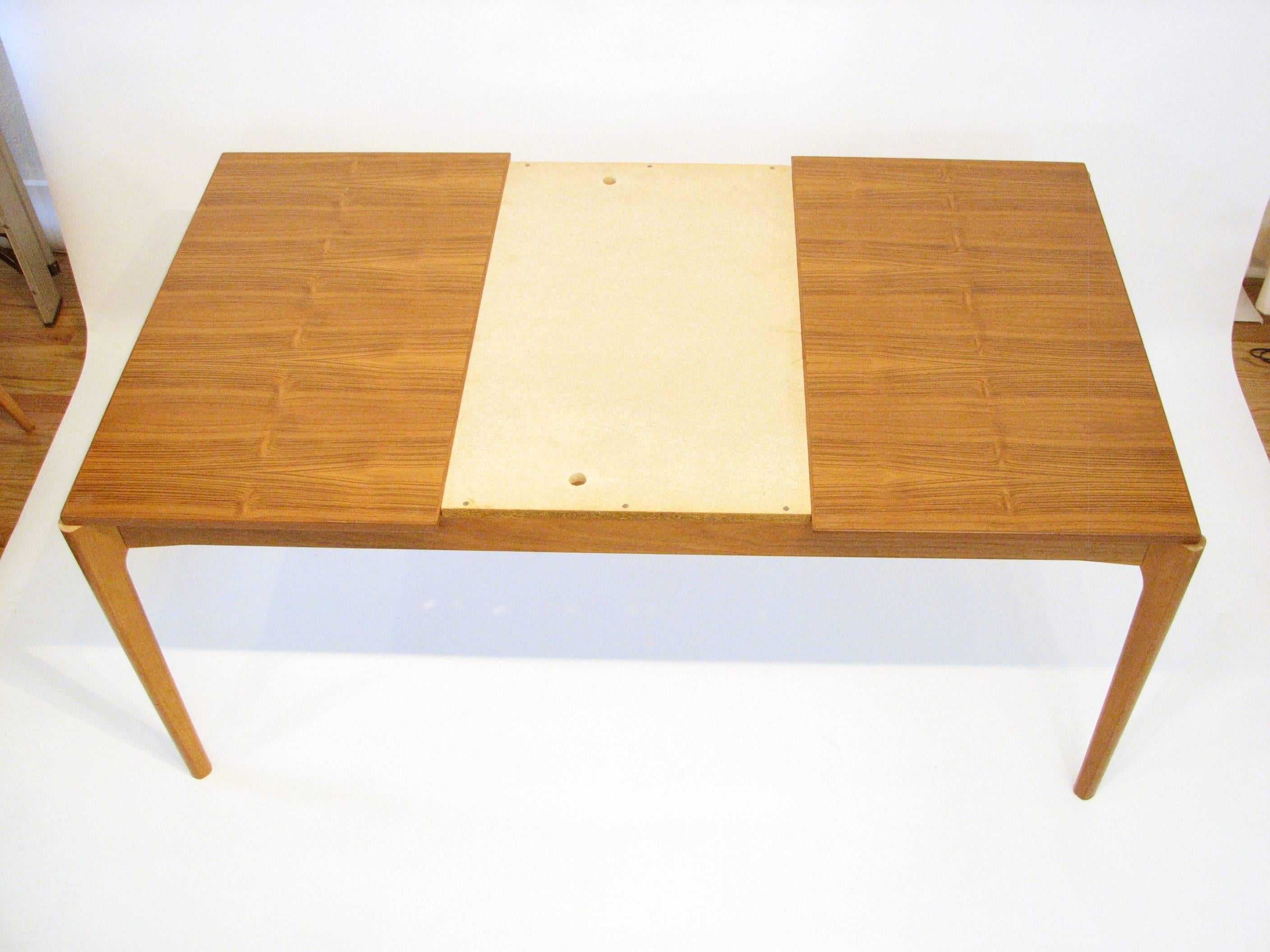 Scandinavian Modern Midcentury Danish Teak Dining Table with Pull-Out Leaves by Henning Kjærnulf