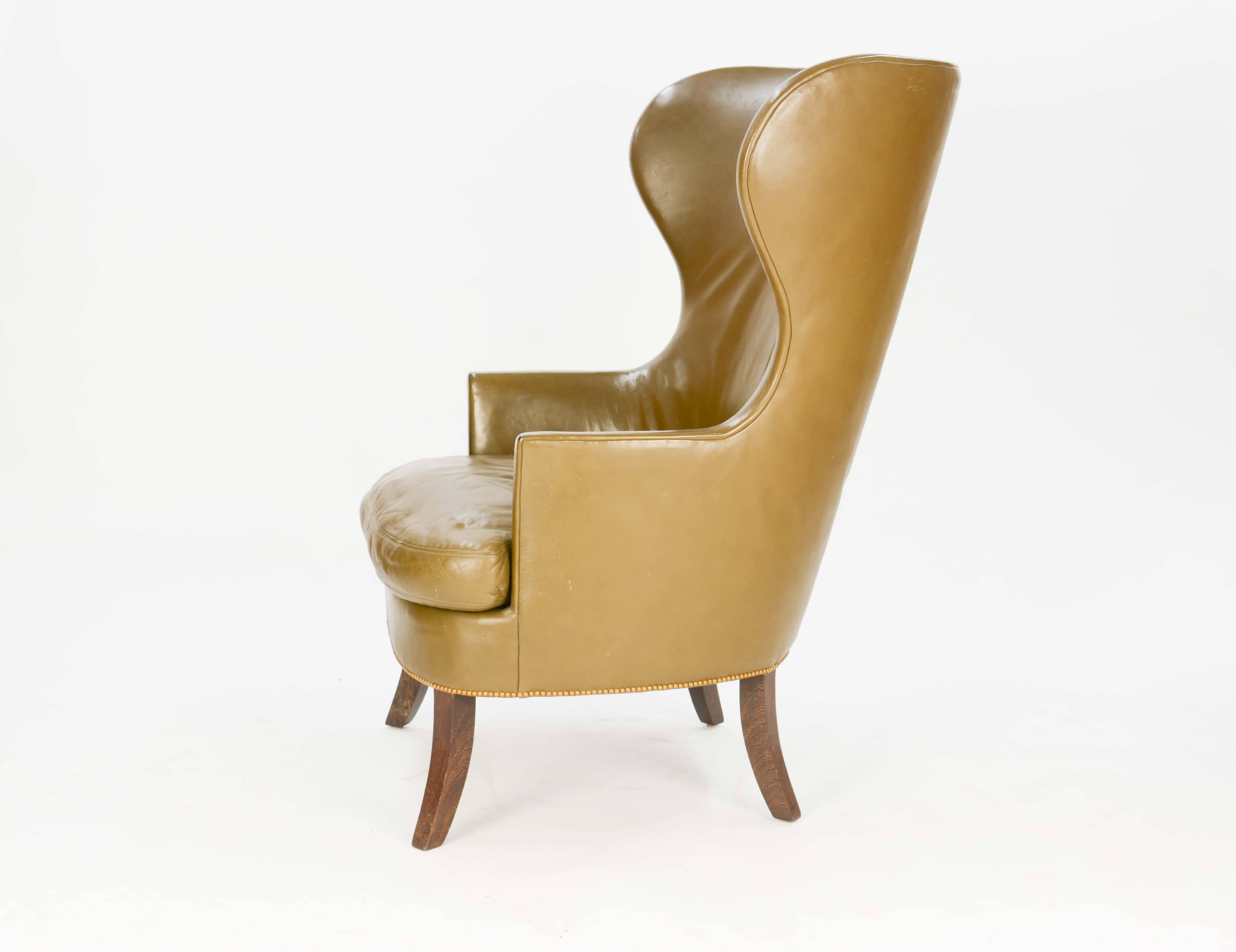 These are our made-to-order wingback club chairs. They are a Danish design, and we can cover them in fabric or leather. The legs, also, can be ebonized or produced in dark walnut. List price does not include upholstery fabric or leather.