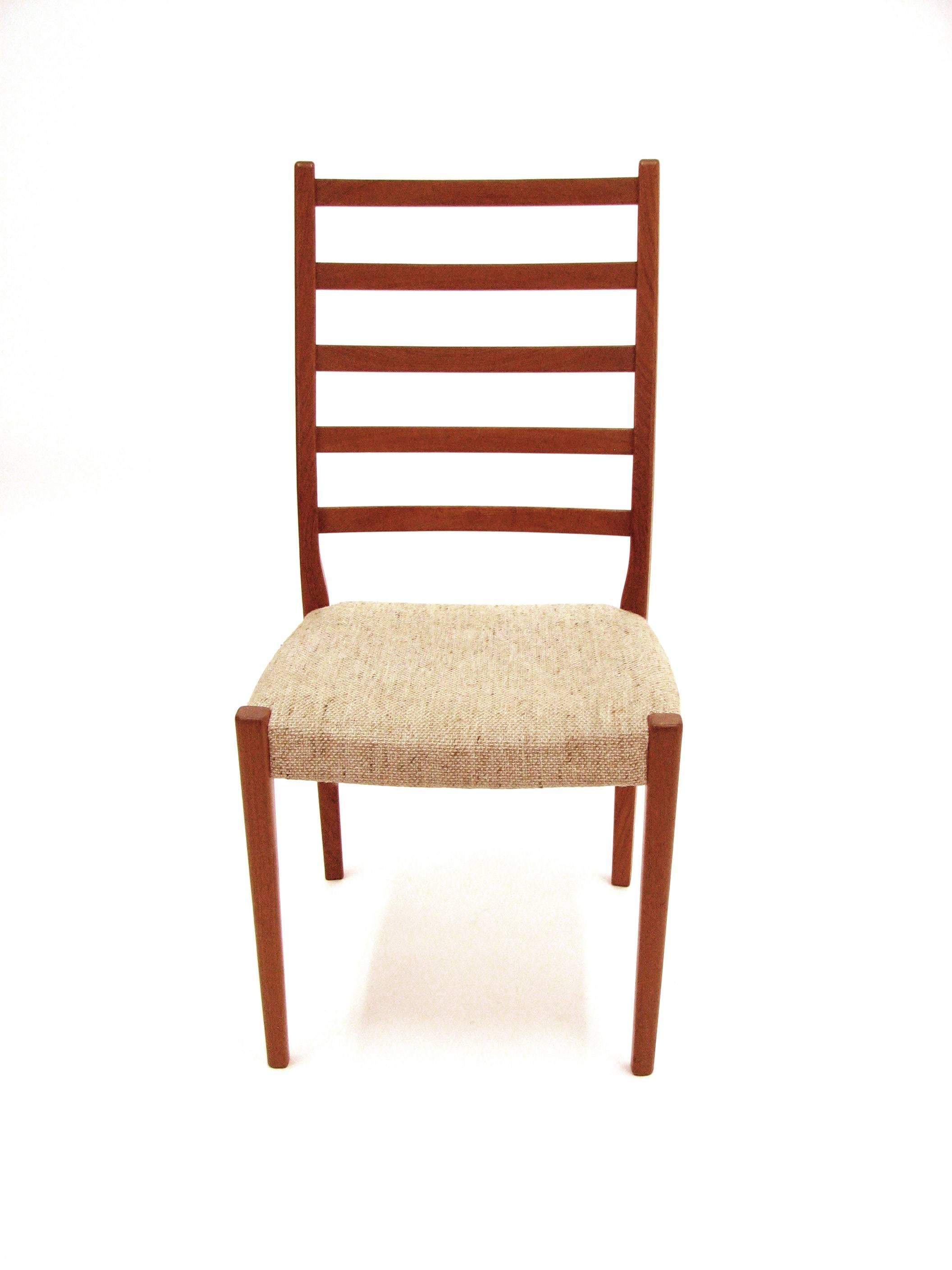 A handsome set of four teak ladder back dining chairs by Svegards Markaryd with original wool weave upholstery.

Chairs are burnt marked Svegards Markaryd made in Sweden.

Please note: Pickup for these chairs is in Denver, Colorado.
