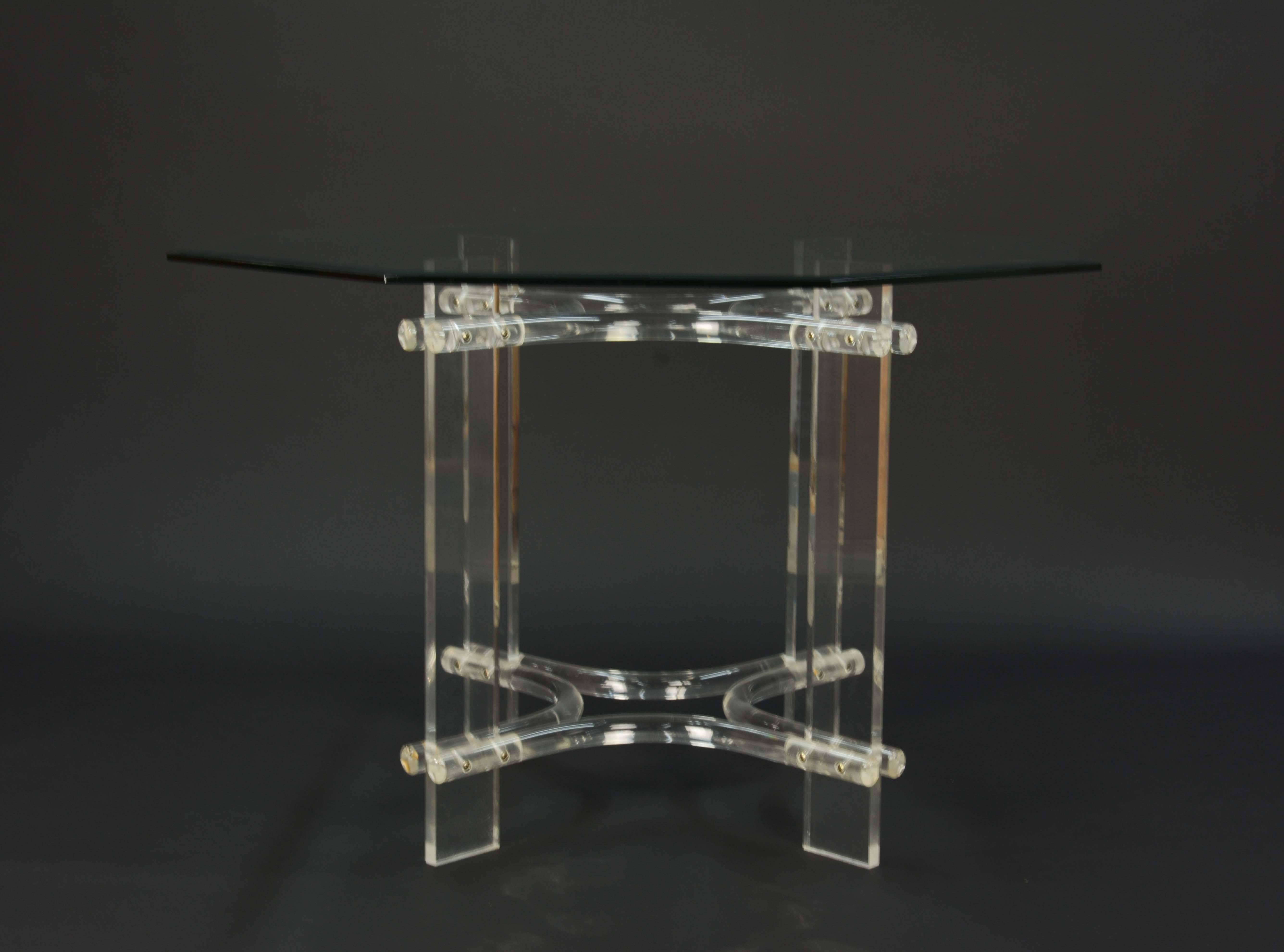 A wonderful set of Lucite and glass top dining set for Hill Manufacturing Company. The chair are in their original burnt orange suede and the Lucite is solid without cracks or breaks. Table top is 44