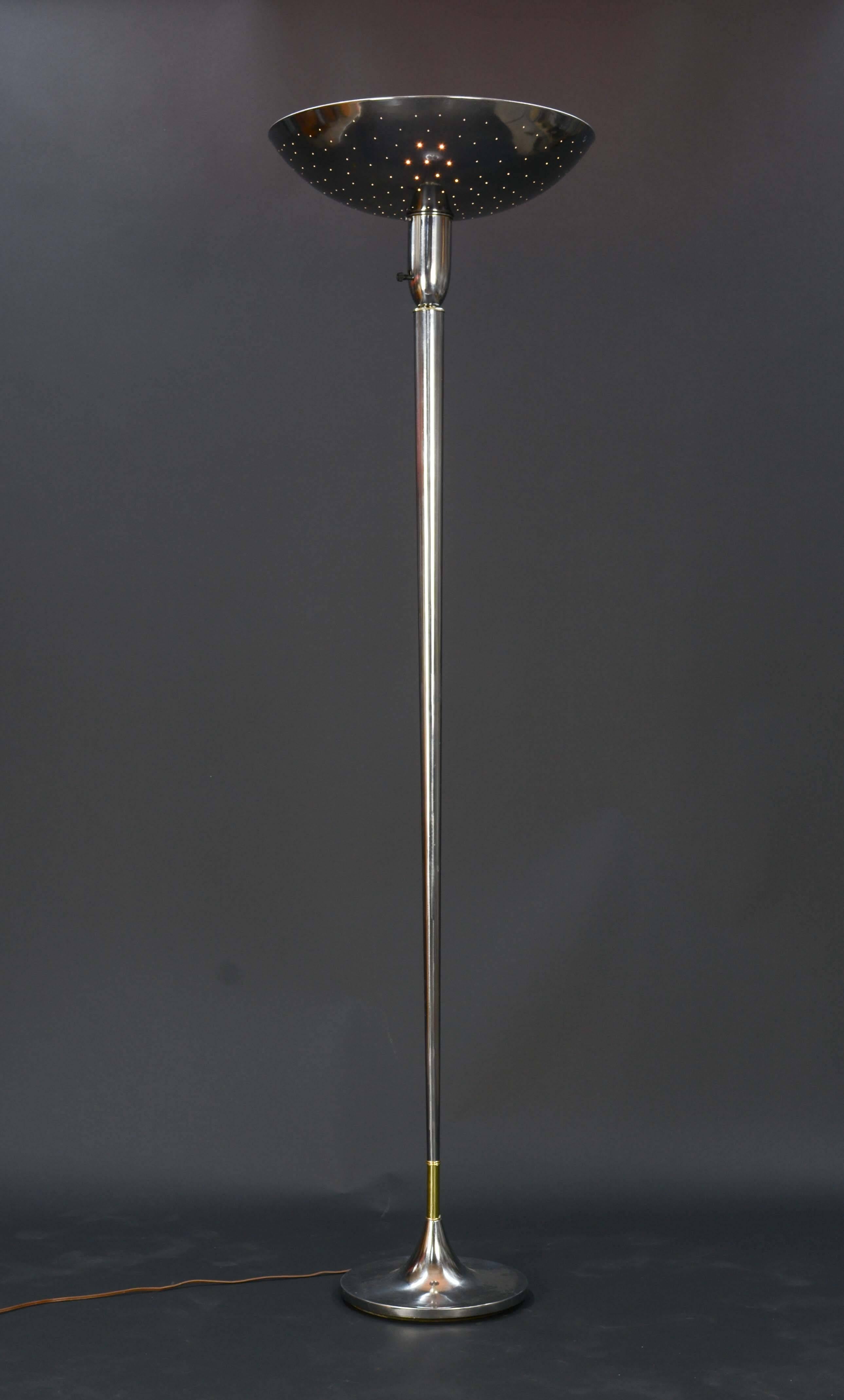 The elegant torchieres cast light upward and outward. The perforated tops makes the sparkle with like the evening sky. The stem features brass accent to the base. The lamps have been professionally polished and wired. Base is 11 inches in diameter