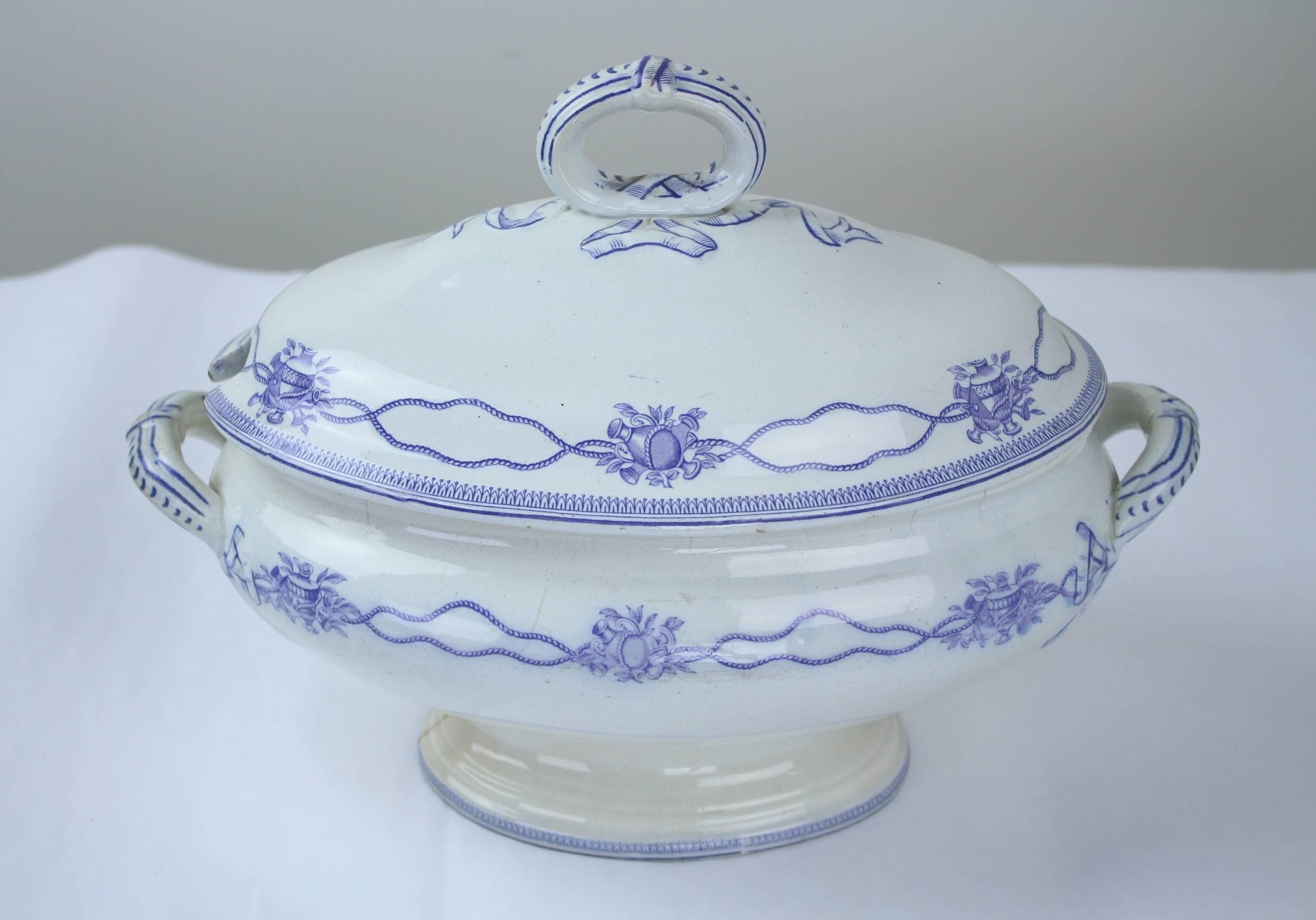 A mid-19th century pottery soup tureen with a blue ribbon pattern and looped handle. Highly decorative, but sadly without its original ladle. There is a 