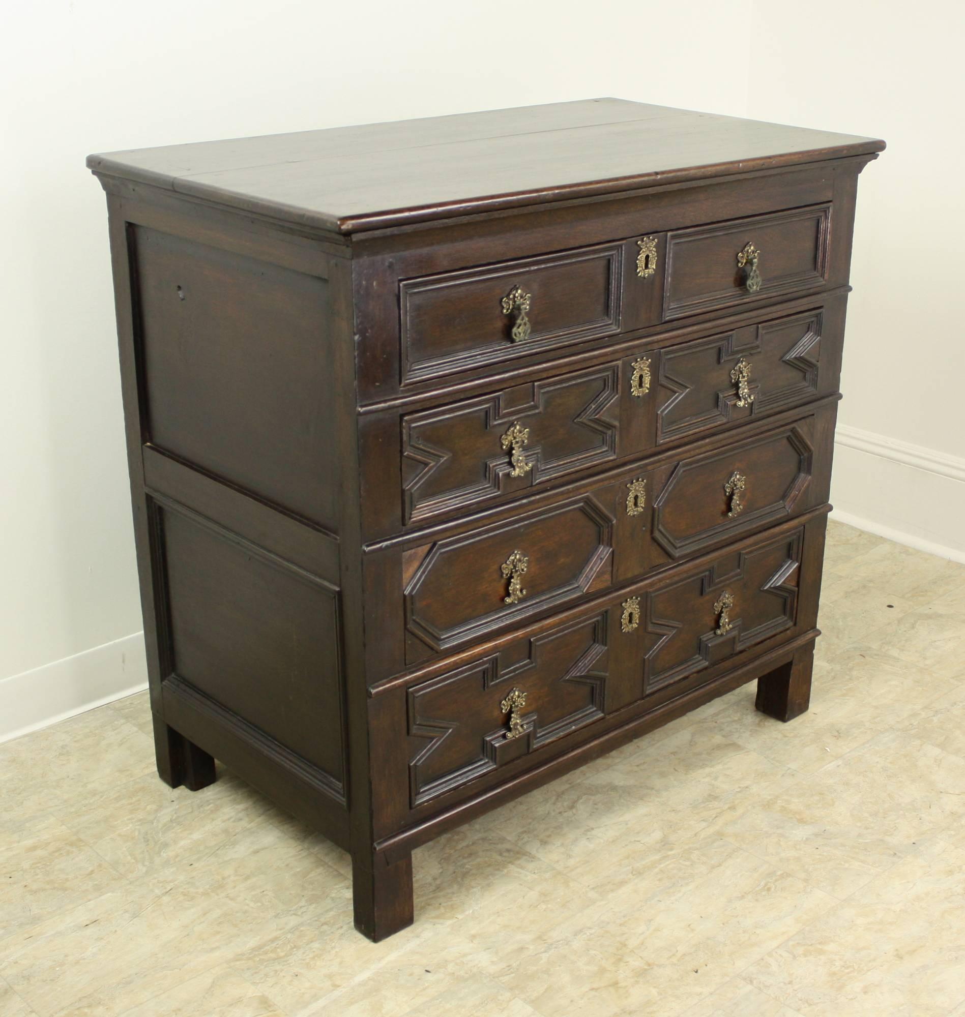 In the Jacobean style, this very early oak piece dates from the mid-1700s, and presents considerable style and character. Diagonal patterns on the faces of the front drawer are typical of the period and are always an outstanding feature. Drawer