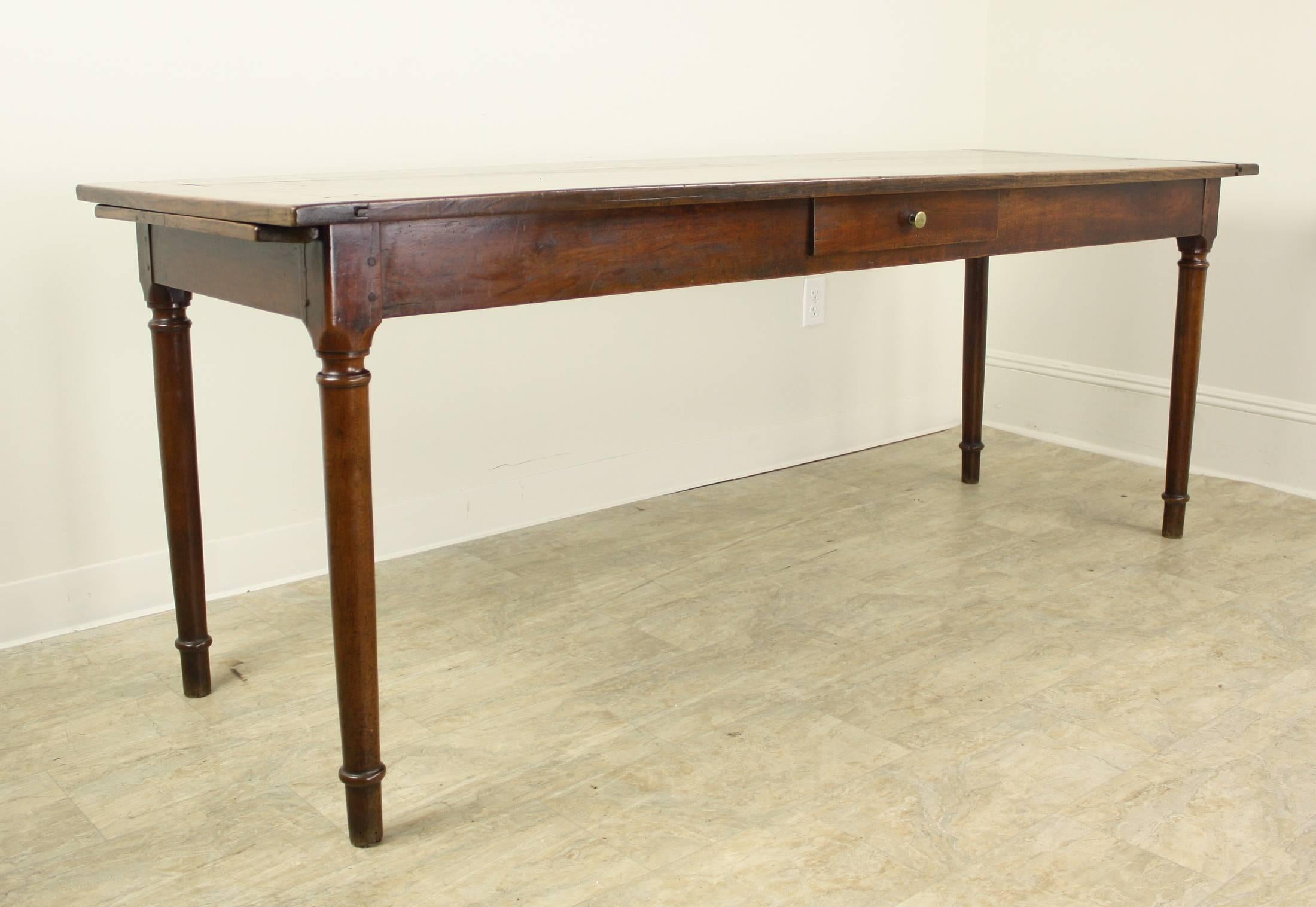 Quite a handsome piece in a lovely warm cherry tone, with the top having very nice breadboard ends. Tho somewhat deep for a server at 26.5