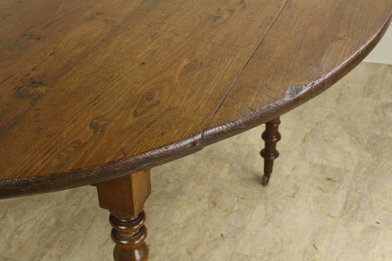 Round Laburnum Dining Table, Turned Legs on Castors at 1stDibs