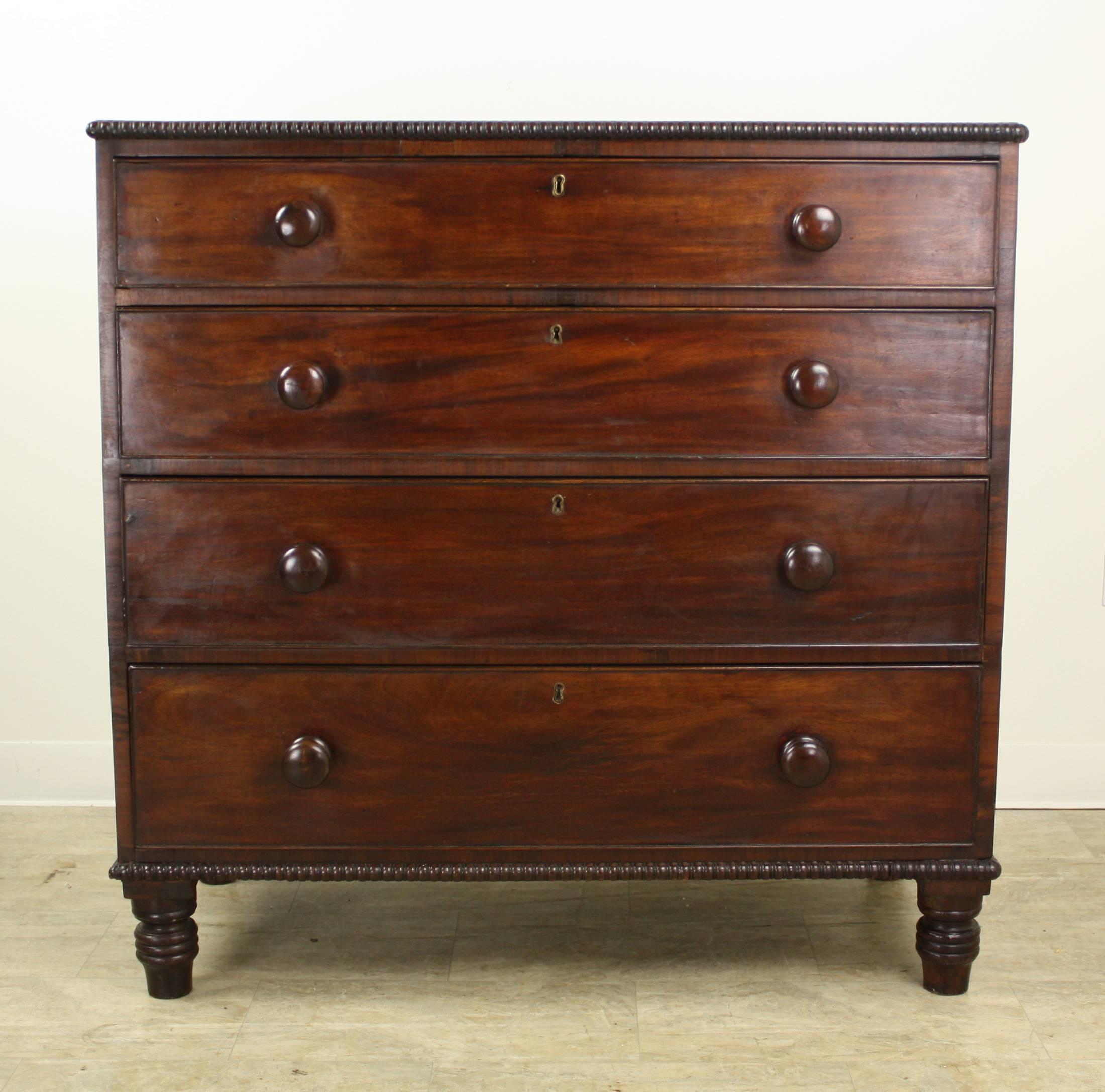 A charming mahogany chest with a traditional decorative bobbin edge. Four roomy drawers and lovely turned feet. The drawers slide easily and the top is in very good condition.