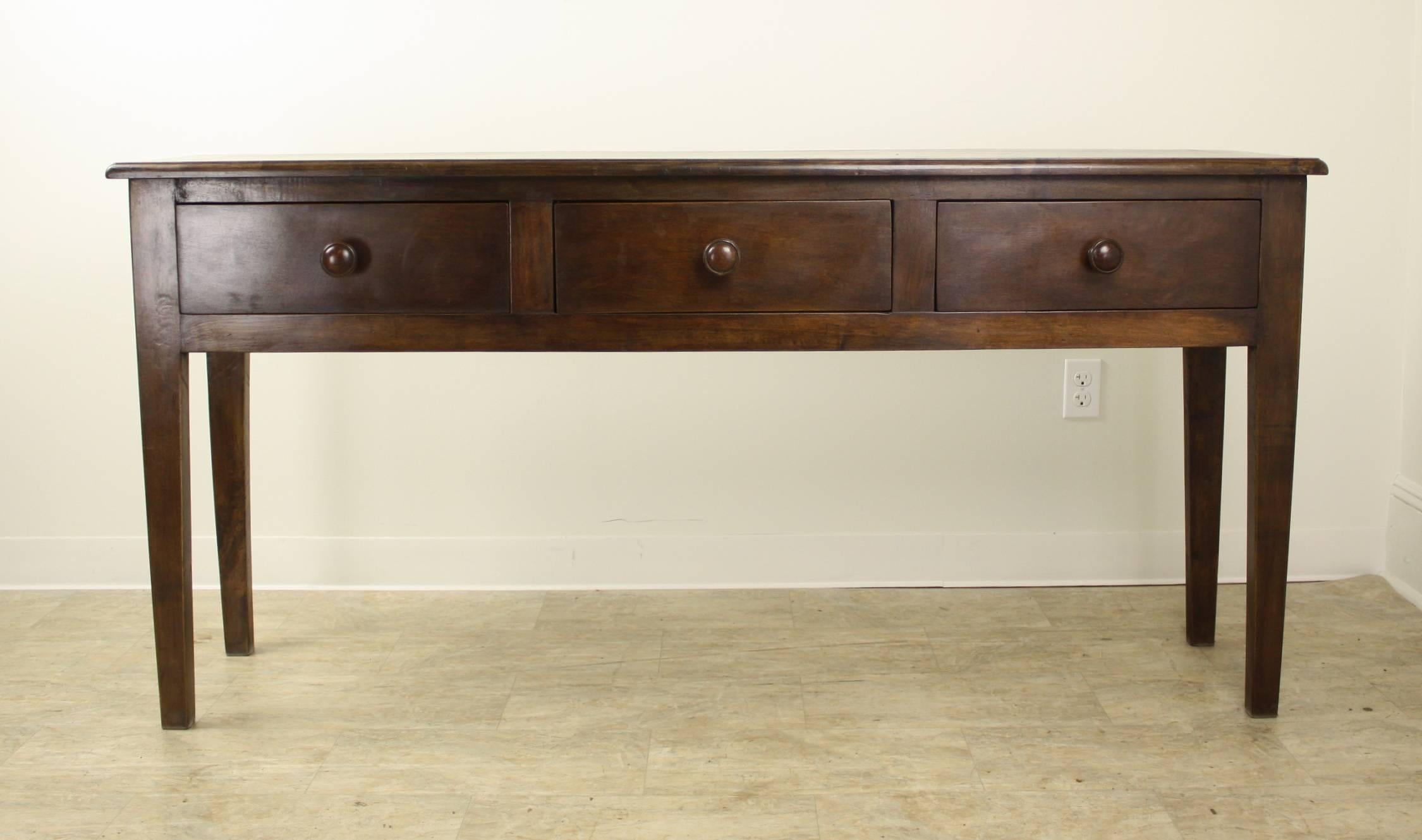 This handsome piece boasts the Classic three-drawer style on sturdy, slightly tapered legs.. At 15.25