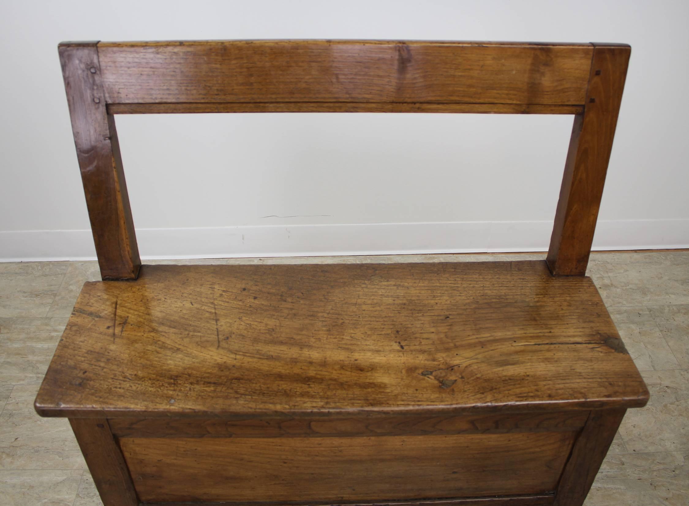 A sweet little bench for the hallway, bedroom or fire side. Mellow chestnut with lovely patina and charming inset panels. The single drawer is quite deep and can provide useful storage.